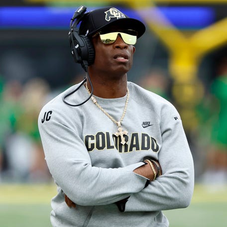 Deion Sanders looks on during Colorado's 42-6 loss to Oregon.