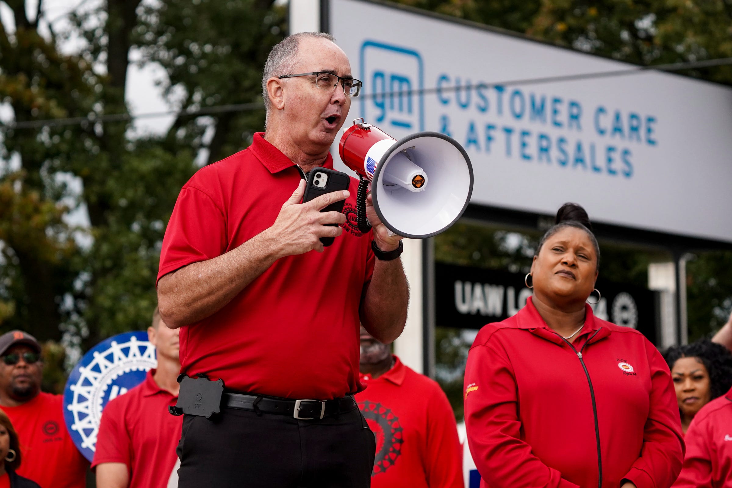 UAW President Shawn Fain speaks to workers picketing at General Motors Willow Run Redistribution in Belleville on Tuesday, September 26, 2023, during a stop to Michigan by President Joe Biden.