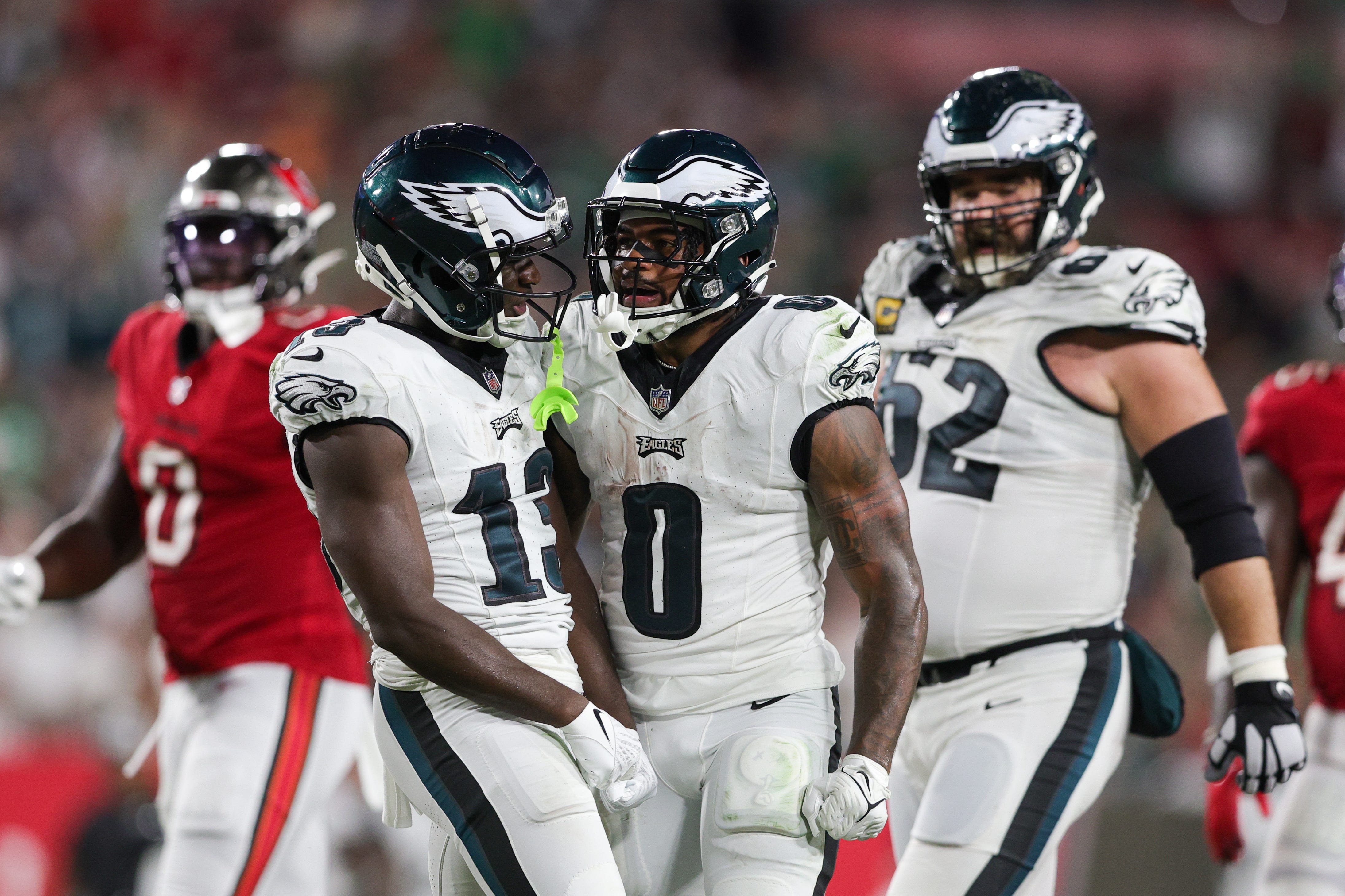 Philadelphia Eagles running back D'Andre Swift (0) and wide receiver Olamide Zaccheaus (13) react after a run against the Tampa Bay Buccaneers.