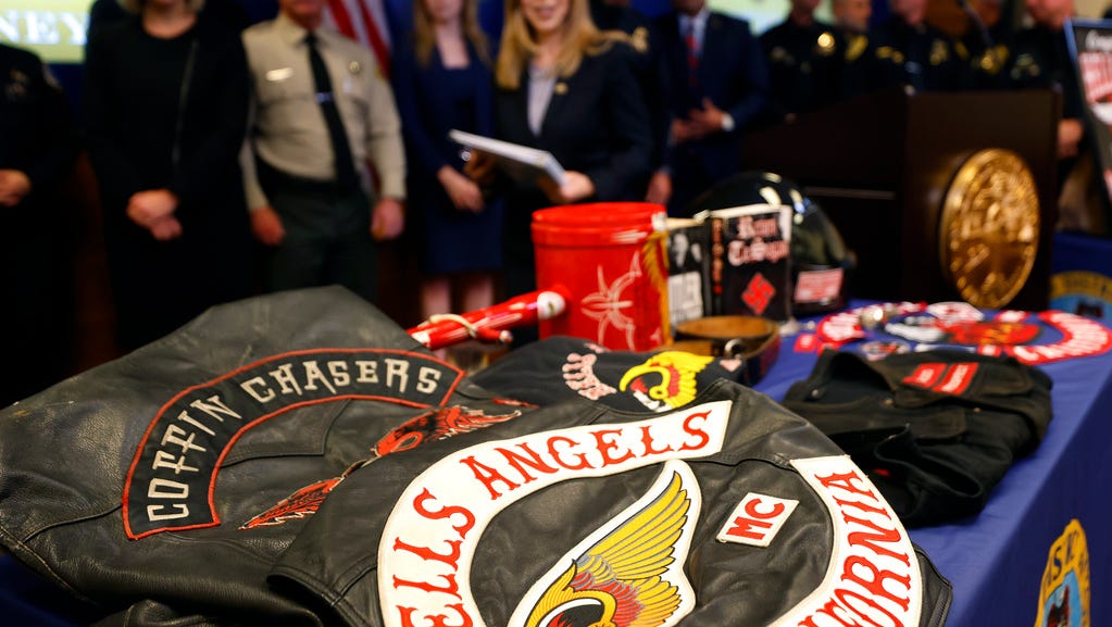 Evidence is shown at a news conference Monday, Sept. 25, 2023, in San Diego, after San Diego County District Attorney Summer Stephan announced grand jury indictments of 17 defendants in connection with a violent attack against three Black men by members of the Hell's Angels biker gang in Ocean Beach earlier this year. (K.C. Alfred/The San Diego Union-Tribune via AP)
