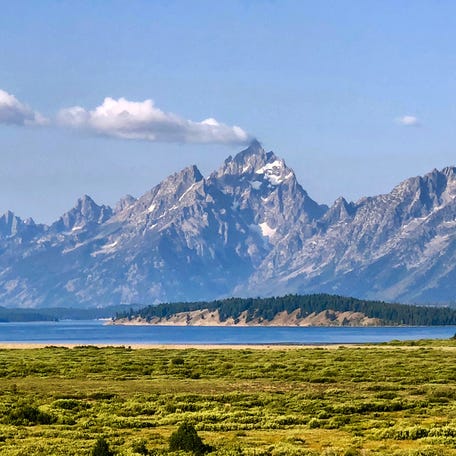 Summer clouds drift over the towering peaks of Grand Teton National Park in this August 2018 file photo.