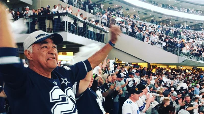 Juan Mejia, 69, cheers at a Dallas Cowboys football game. He died on June 14, 2021, in Houston after a battle with cancer.