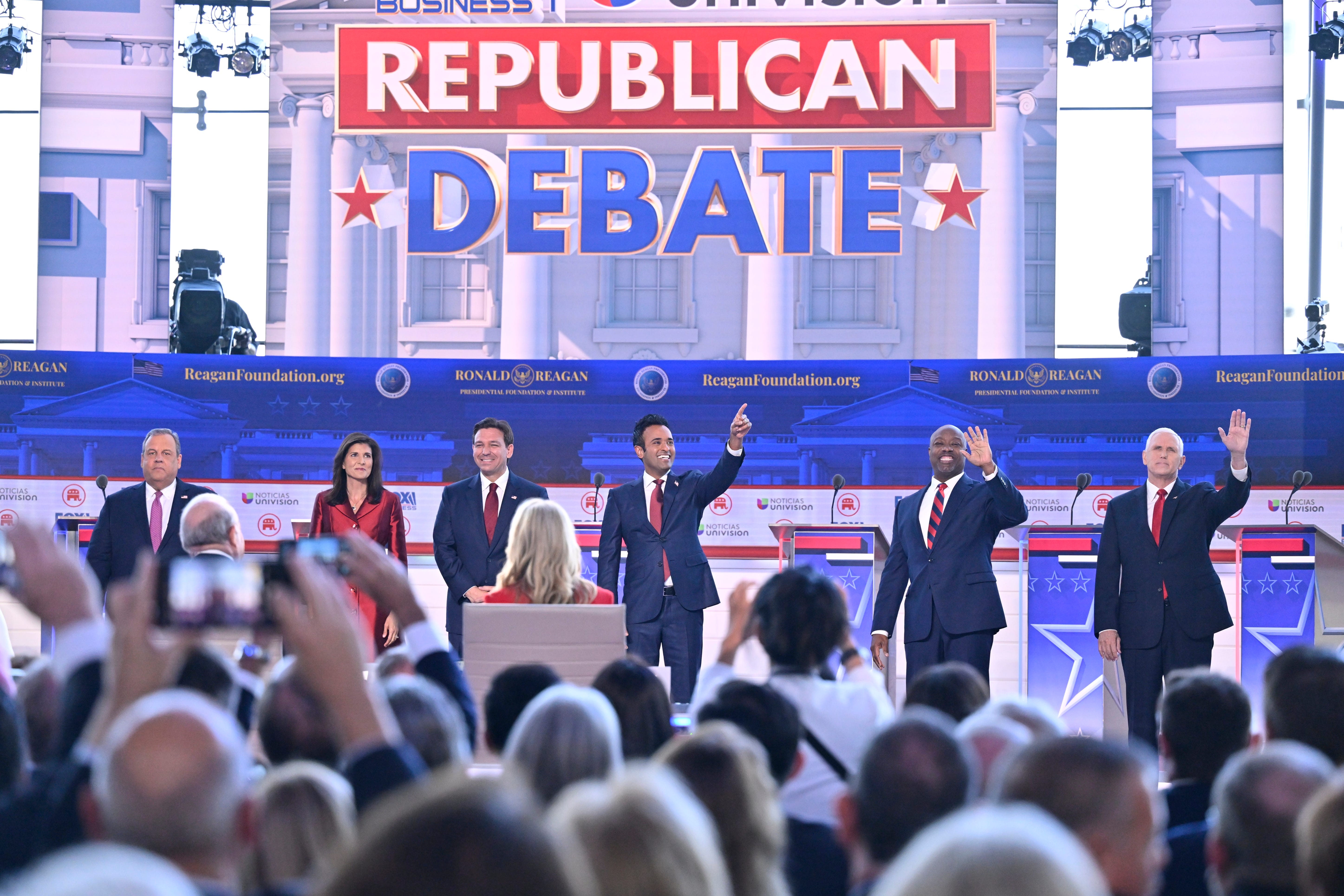 (from left) Republican candidates former New Jersey Gov.ÊChris Christie, former South Carolina Gov.ÊNikki Haley, Florida Gov.ÊRon DeSantis, businessmanÊVivek Ramaswamy , South Carolina Sen.ÊTim Scott and former Vice PresidentÊMike Pence gather on stage ahead of the FOX Business Republican presidential primary debate at the Ronald Reagan Presidential Library and Museum.