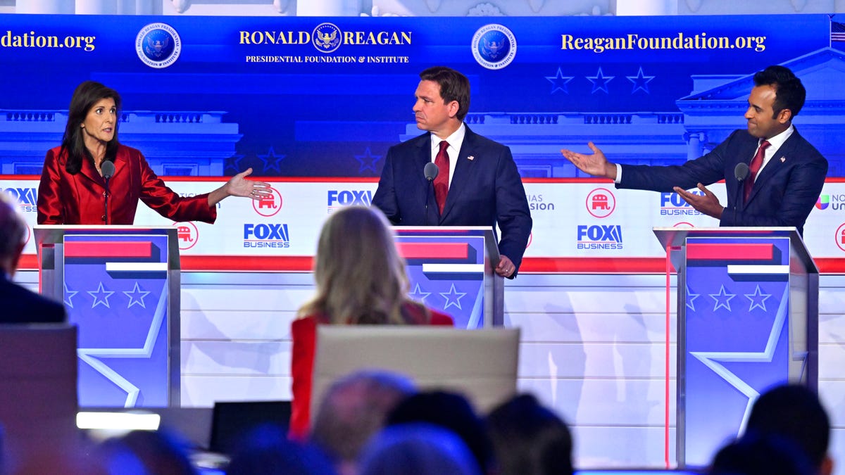 (From left) Former South Carolina Gov. Nikki Haley, Florida Gov. Ron DeSantis and businessman Vivek Ramaswamy debate during the FOX Business Republican presidential primary debate at the Ronald Reagan Presidential Library and Museum.