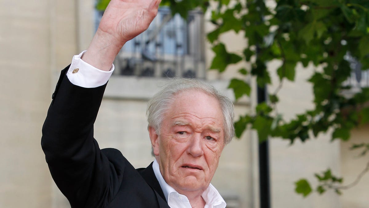 FILE - Actor Michael Gambon arrives in Trafalgar Square, in central London, for the World Premiere of Harry Potter and The Deathly Hallows: Part 2, the last film in the series, Thursday, July 7, 2011. Actor Michael Gambon, who played Dumbledore in the later Harry Potter films, has died at age 82, his publicist says. (AP Photo/Joel Ryan, File) ORG XMIT: DSOB101