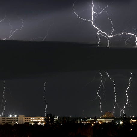 Lightning strikes ahead of a cold front moving into the region in West Palm Beach, Florida, March 20, 2018. (Greg Lovett / The Palm Beach Post)