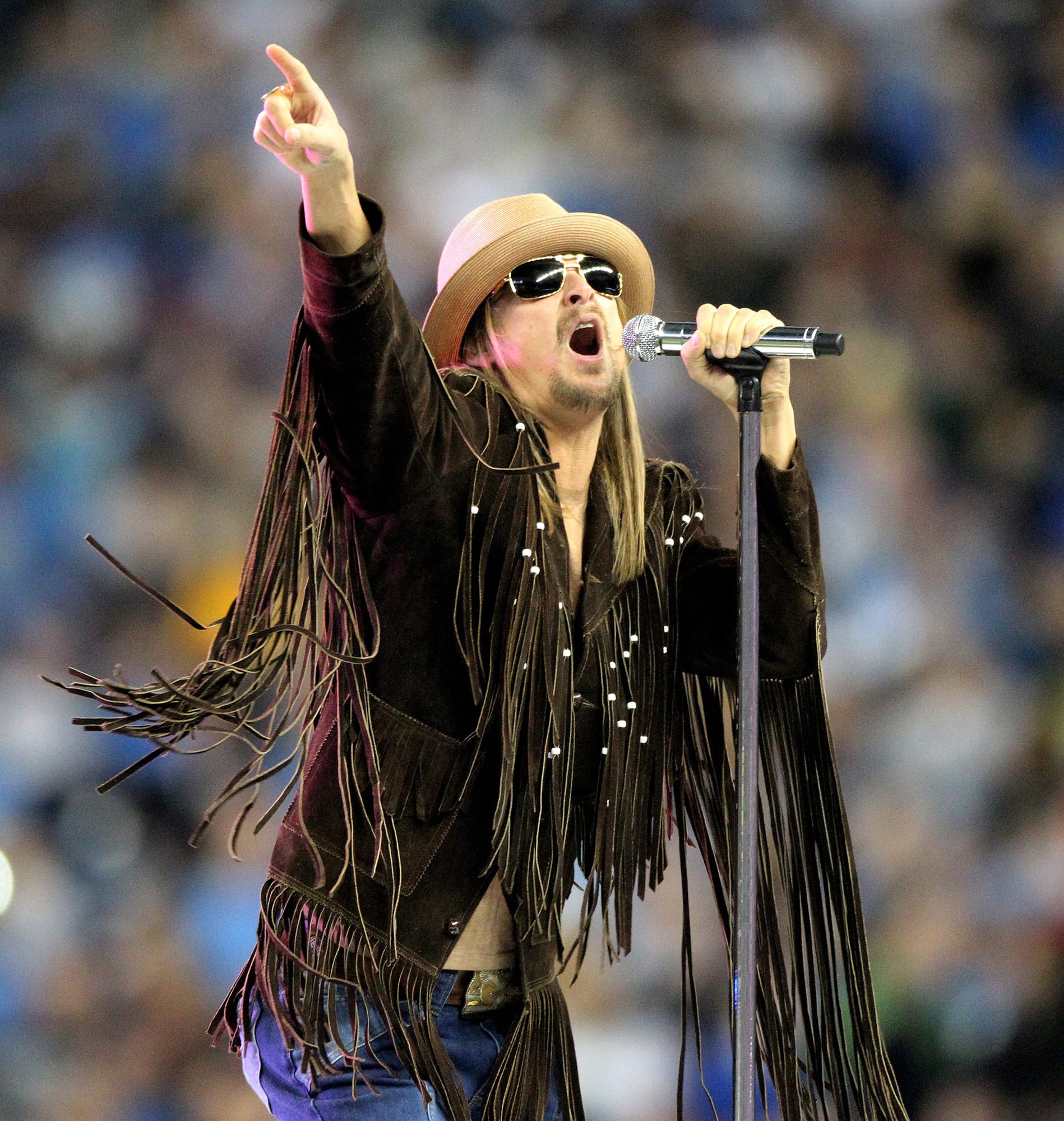 2010: New England Patriots fan Kid Rock provided some of the half time entertainment at a game against the Detroit Lions.