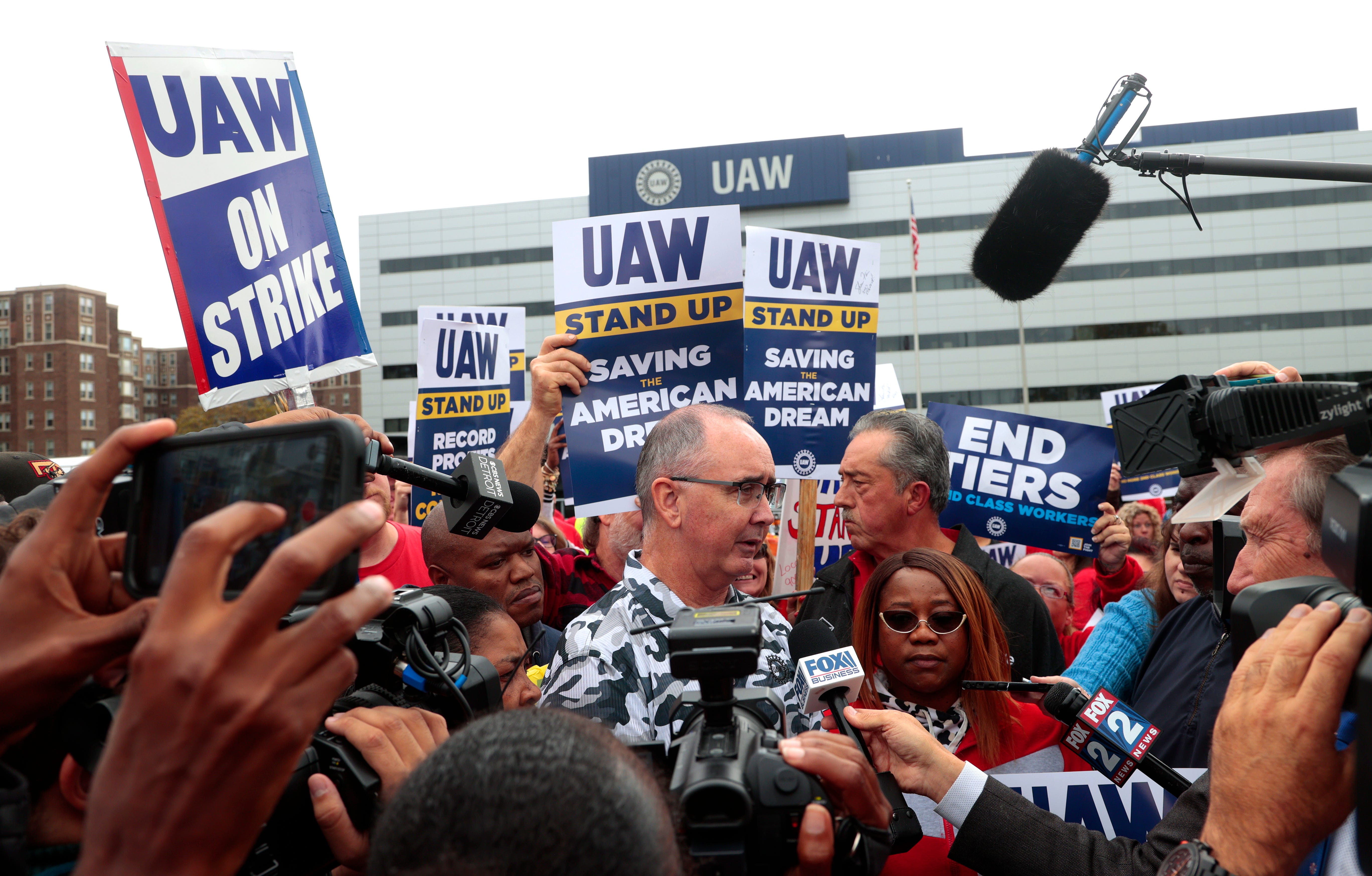 UAW president Shawn Fain talks with the media after his speech from the bed of a Ford F-150 to striking workers many of whom caravanned in Ford Broncos and Jeeps to hear him at the UAW Solidarity House on Jefferson Avenue in Detroit on Friday, September 29, 2023.