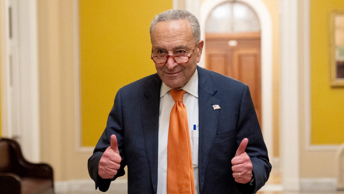 Senate Majority Leader Chuck Schumer, D-N.Y., gives two thumbs up as the Senate votes to approve a 45-day funding bill to keep federal agencies open, Saturday, Sept. 30, 2023, in Washington.