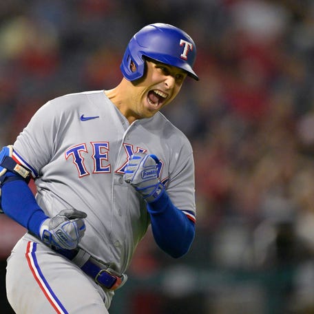 Rangers' Nathaniel Lowe reacts after hitting a home run against the Angels at Angel Stadium in Anaheim, Calif. on Sept. 25, 2023.
