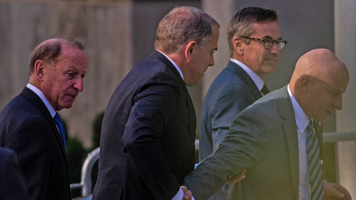 Hunter Biden and his legal team arrive to face felony gun charges at Delaware District Court in Wilmington, Tuesday, Oct. 3, 2023. Biden is expected to plead not guilty.