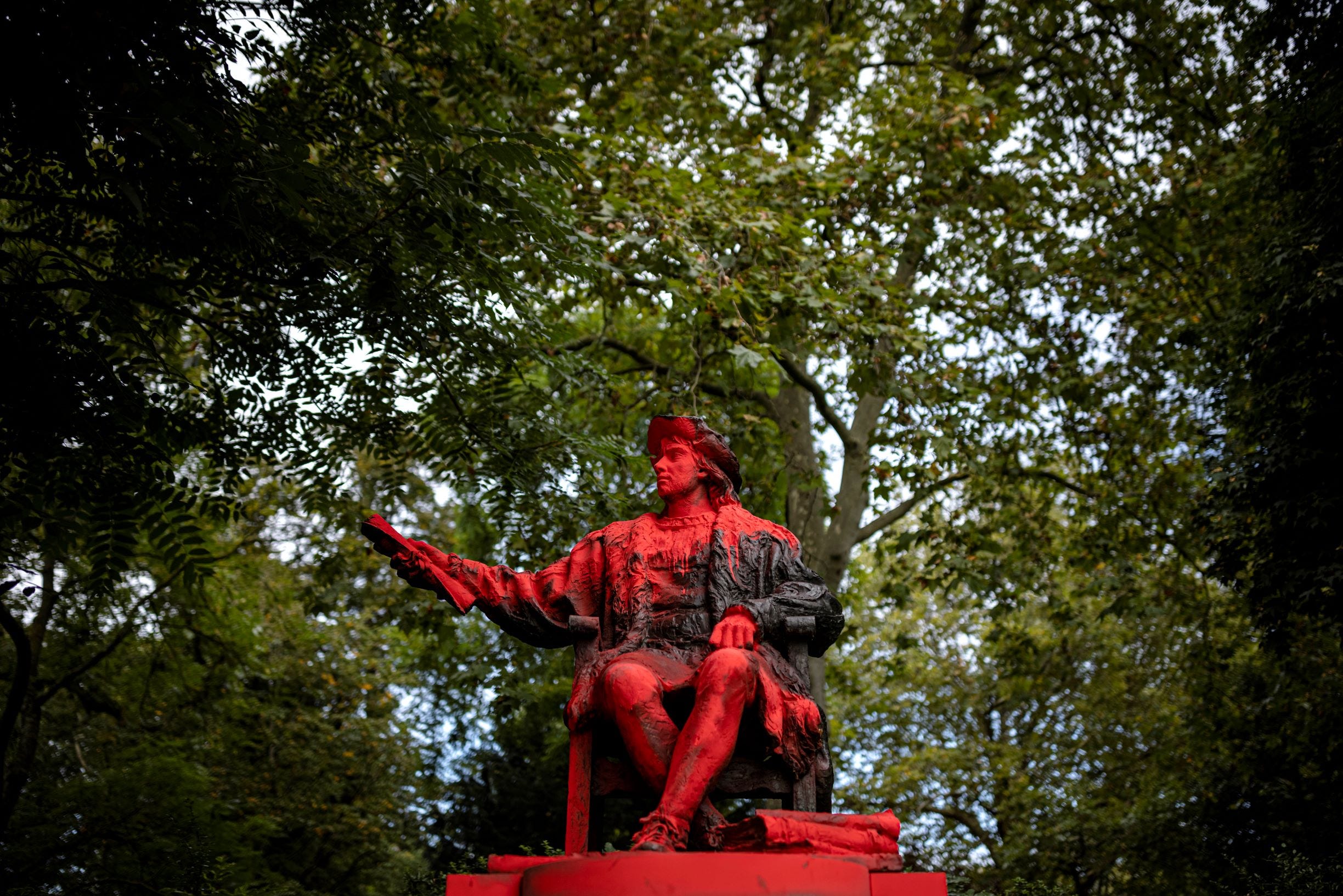 LONDON, ENGLAND - OCTOBER 12: Red paint covers a statue of Christopher Columbus in Belgrave Square Gardens on October 12, 2021 in London, England. The defacing of the statue appears to coincide with the Columbus Day holiday, which many countries in the Americas celebrate on October 12. The holiday is observed on second Monday in October in the United States. (Photo by Rob Pinney/Getty Images)