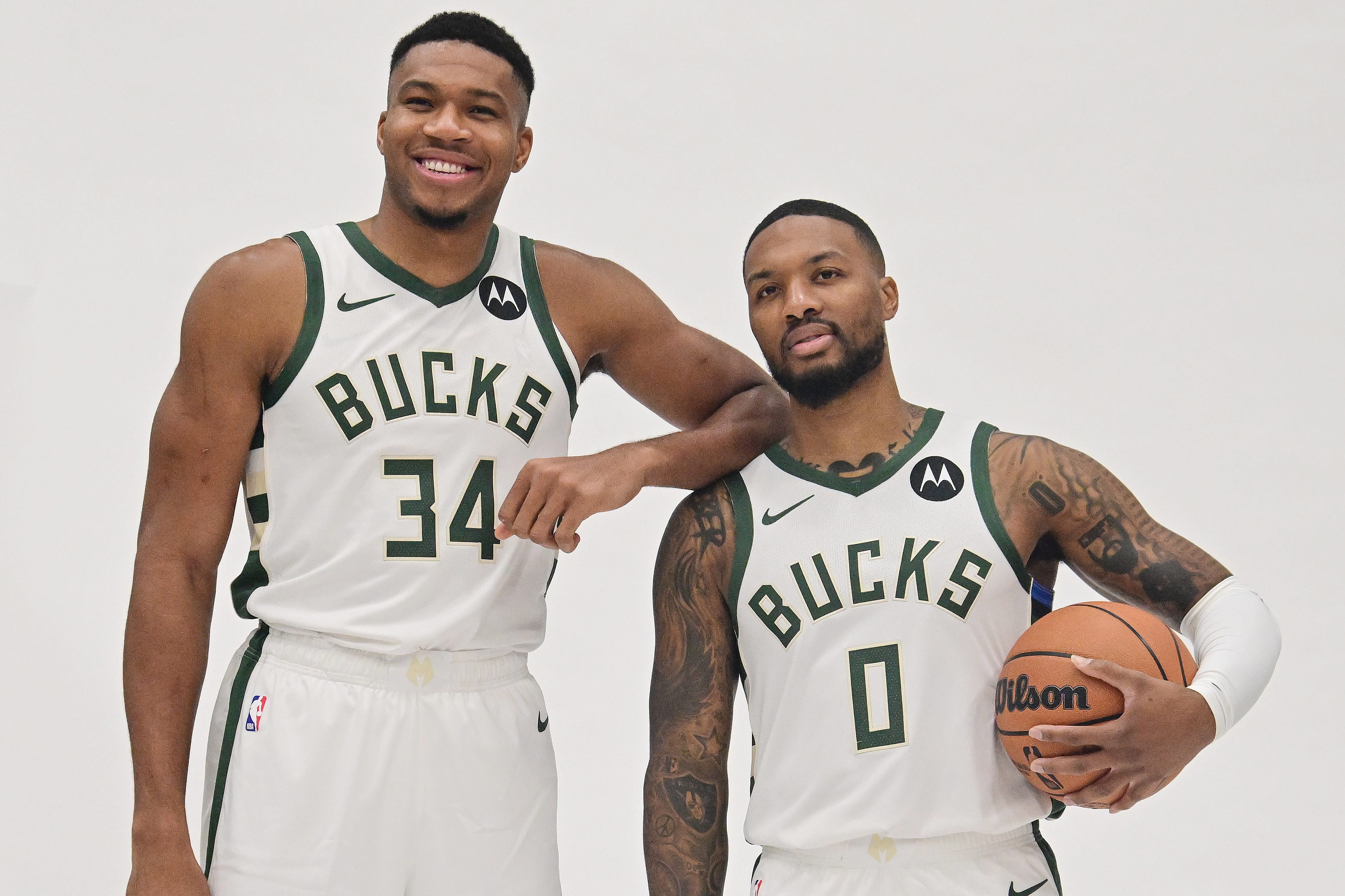 The Bucks believe Damian Lillard (right) will help them to another NBA title and keep Giannis Antetokounmpo (left) happy in Milwaukee.