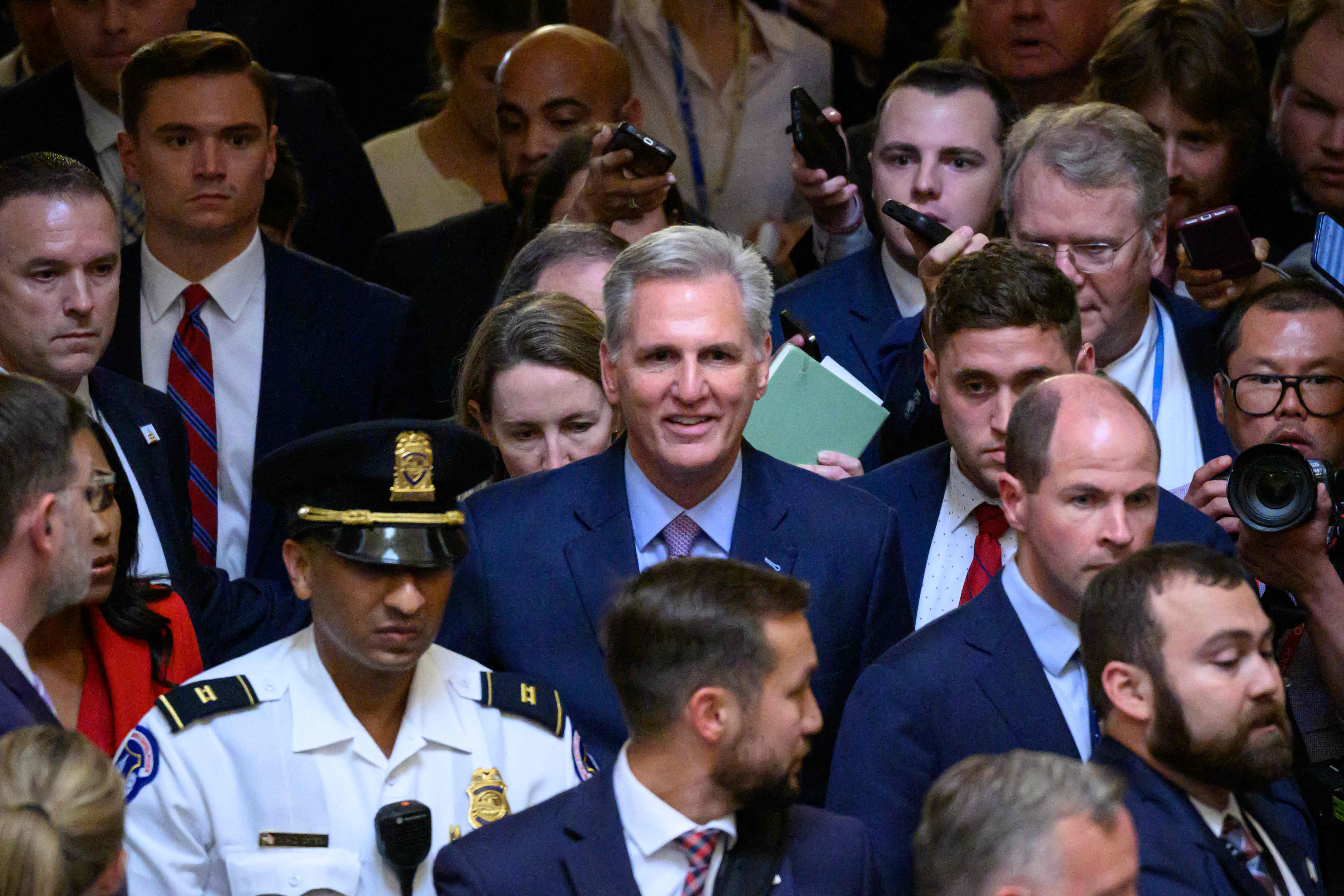 TOPSHOT - US Republican Representative from California Kevin McCarthy walks from the House Chamber after he was ousted as Speaker at the US Capitol in Washington, DC, on October 3, 2023. McCarthy was axed from his role as speaker of the US House of Representatives Tuesday in a ruthless overthrow by far-right Republican lawmakers furious over his cooperation with Democrats. For the first time in its 234-year history, the House backed a resolution "to   vacate the office of the speaker" with a 216-210 vote setting the stage for an unprecedented contest to replace McCarthy a year before the presidential election. (Photo by Mandel NGAN / AFP) (Photo by MANDEL NGAN/AFP via Getty Images) ORIG FILE ID: AFP_33XE8E3.jpg