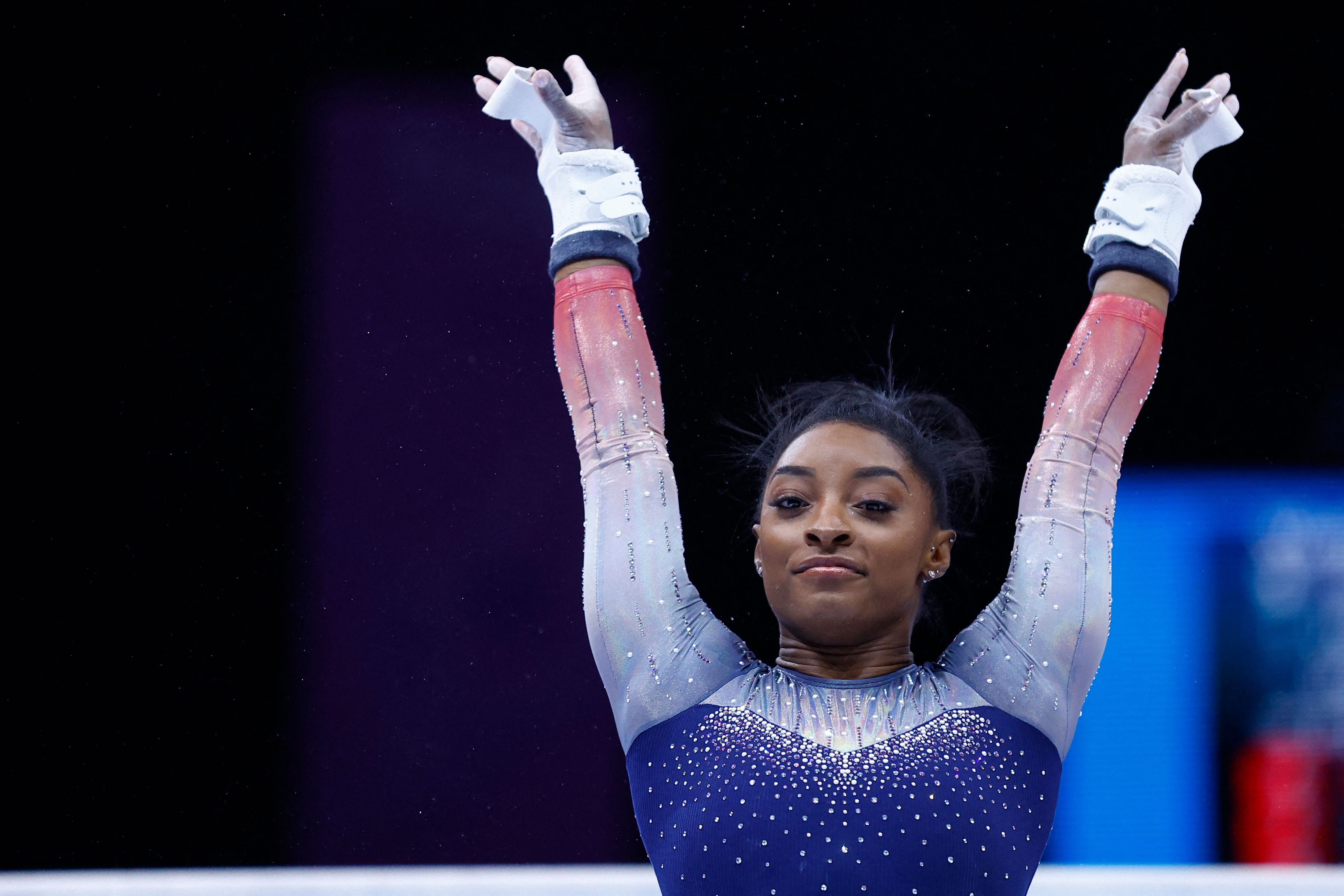 Simone Biles competes on the uneven bars in the women's team final during the World Championships, in Antwerp, northern Belgium, on October 4, 2023.