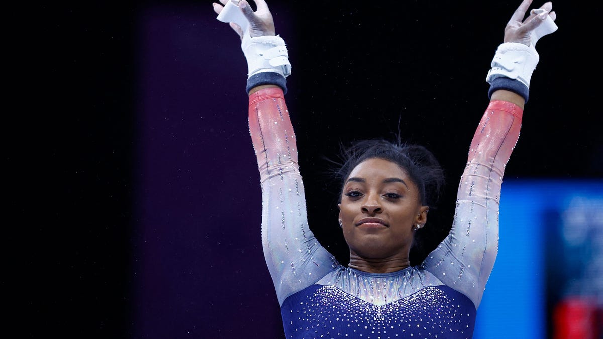 Simone Biles competes on the uneven bars in the women's team final during the World Championships, in Antwerp, northern Belgium, on October 4, 2023.