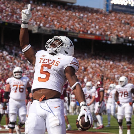Texas running back Bijan Robinson celebrates a touchdown during the annual Red River Showdown against Oklahoma at the Cotton Bowl in Dallas, Texas on Oct. 8, 2022.