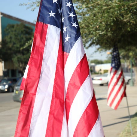 American flags are displayed in celebration of Columbus Day, Oct. 8, 2020 in downtown Carlsbad.