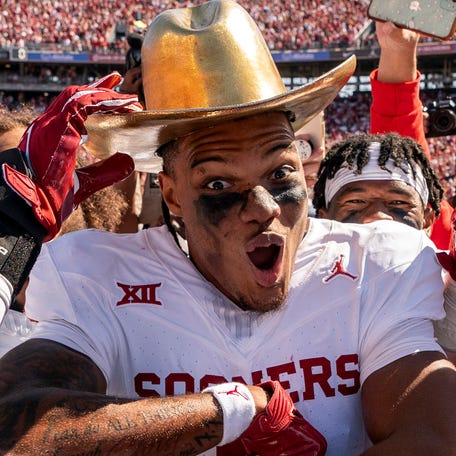 Oklahoma wide receiver Jayden Gibson celebrates with the Golden Hat after defeating Texas 34-30 at the Cotton Bowl.