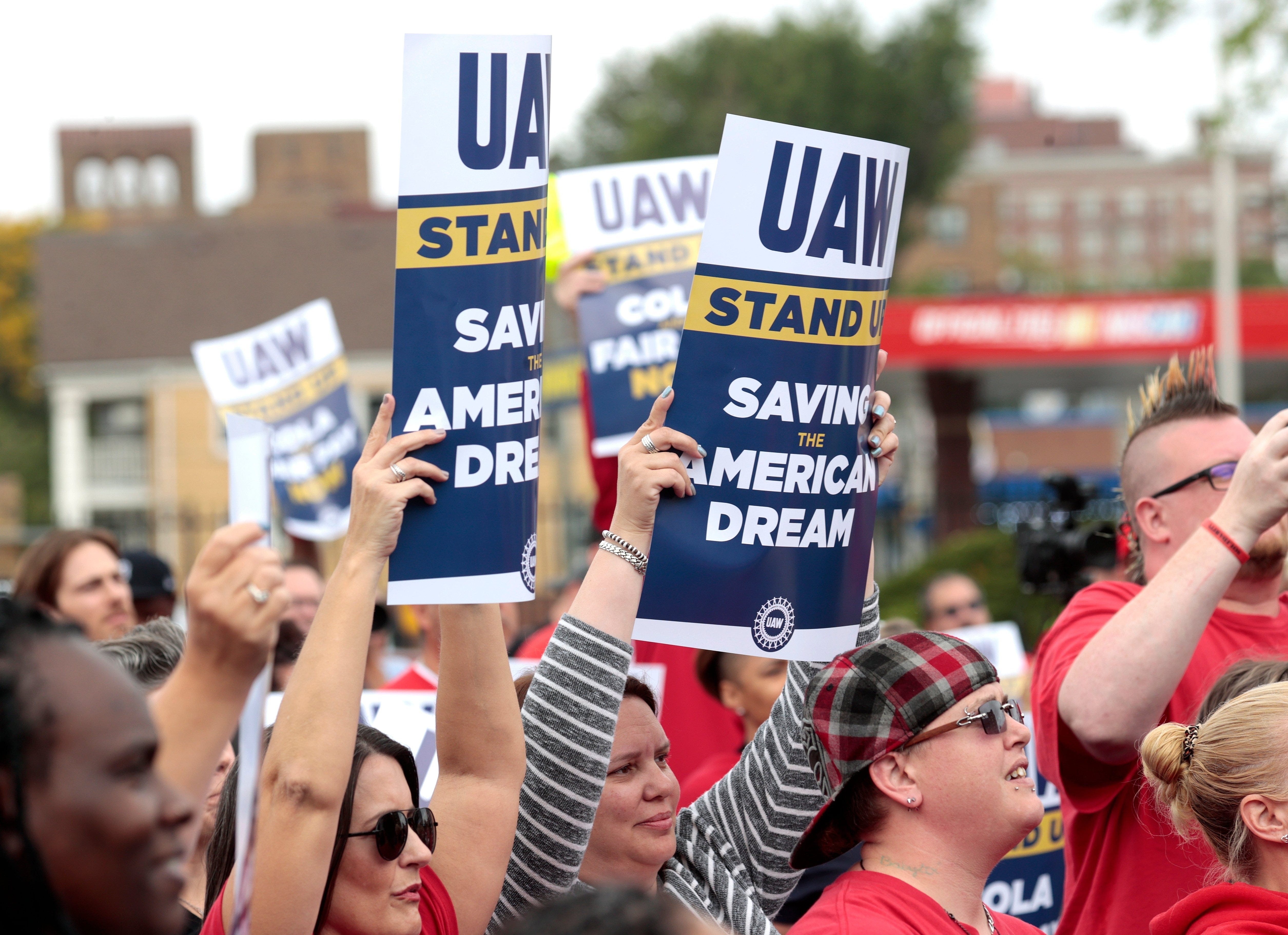 Striking workers, many of whom caravanned in Ford Broncos and Jeeps, listen to UAW president Shawn Fain talk at the UAW Solidarity House on Jefferson Avenue in Detroit on Friday, Sept. 29, 2023.
