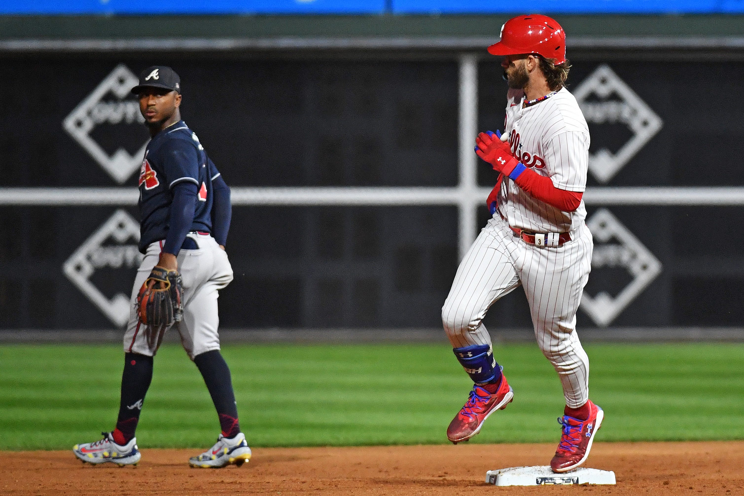 Bryce Harper stares down Orlando Arcia after his home run in the fifth inning.