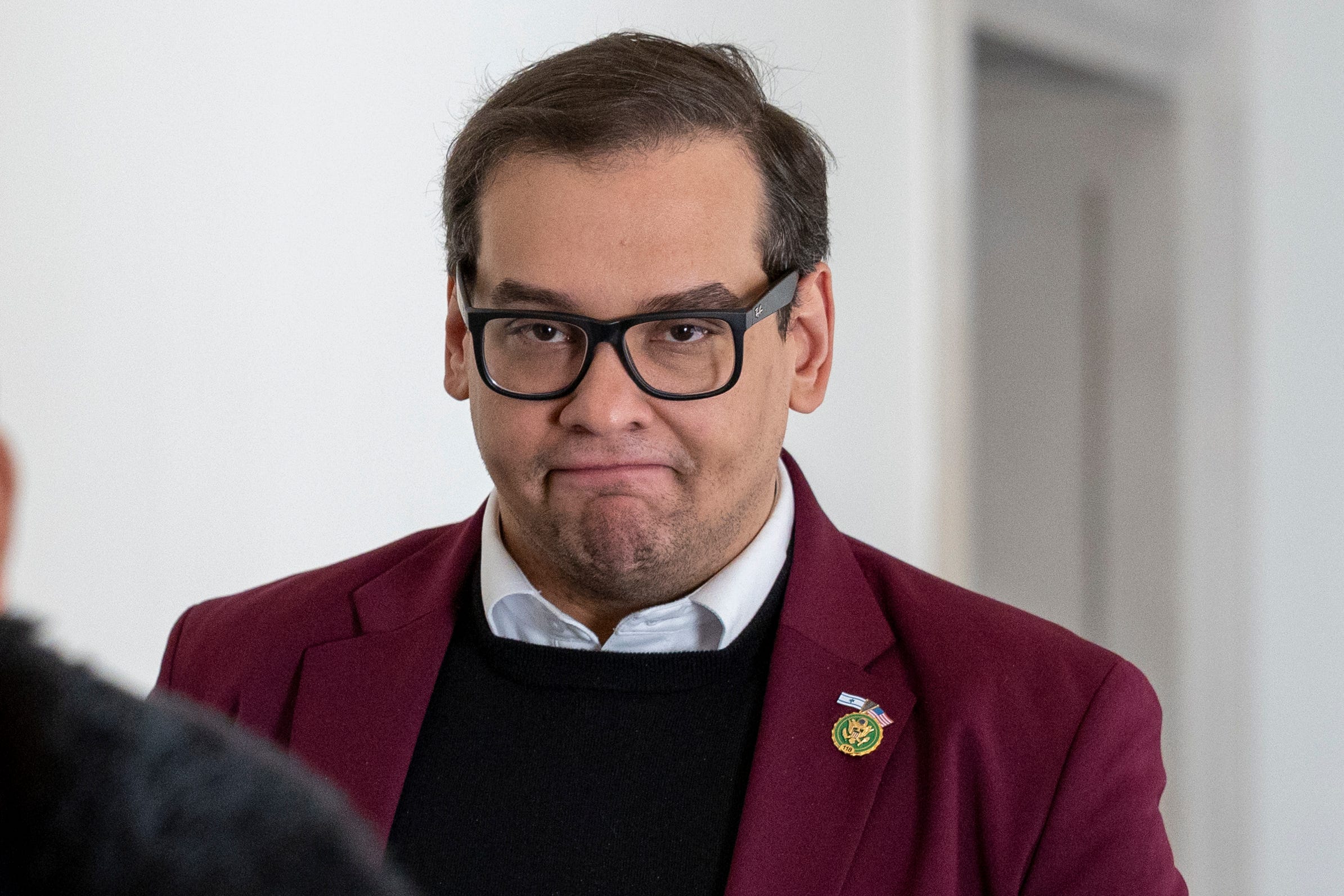 Oct 13, 2023; Washington, DC, USA; Rep. George Santos, R-N.Y., returns to a GOP caucus meeting working to formally elect a new speaker of the House. On Wednesday, House Republicans as a conference formally nominated House Majority Leader Steve Scalise, R-La. for the speaker of the House position. The House still has to formally elect a new speaker on the House floor, and lawmakers are free to nominate other candidates.