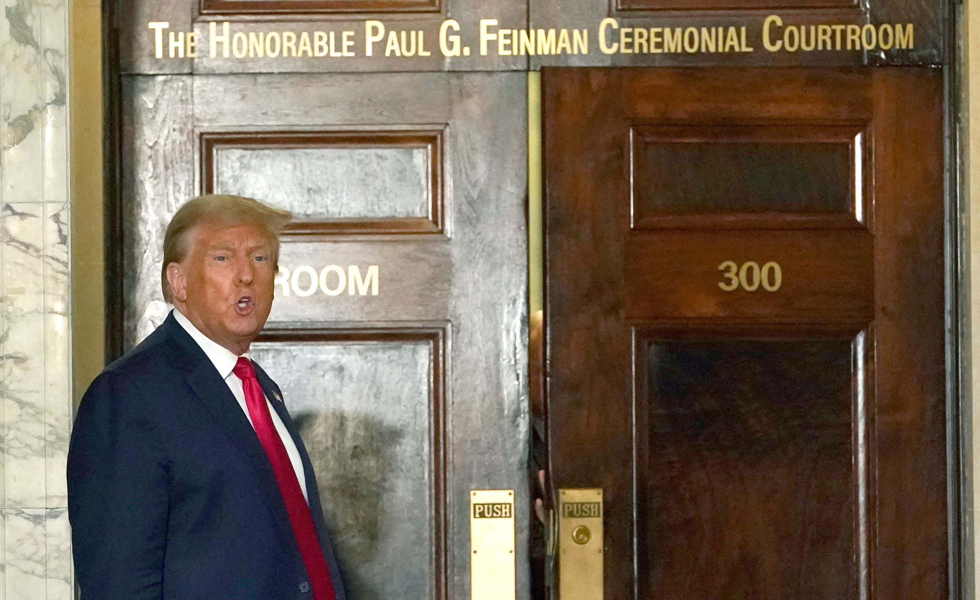 Former President Donald Trump speaks to the press as he returns to court after a break in his $250 million civil fraud trial against him and his company October 17, 2023. Trump attends the trial a day after a federal judge, in a separate criminal case, imposed a partial gag order on Trump, on October 16, 2023.