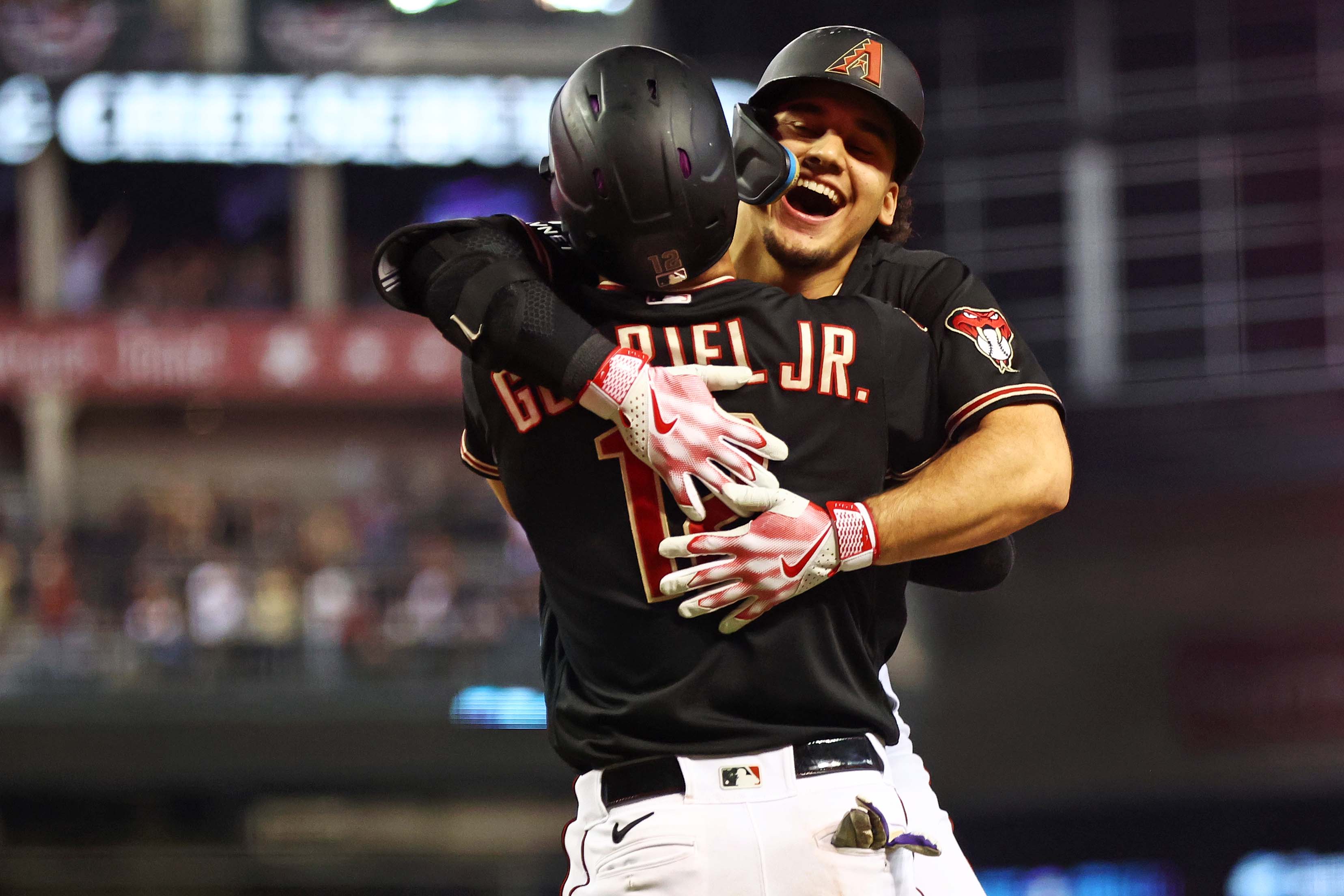 NLCS Game 4: Arizona Diamondbacks center fielder Alek Thomas (5) celebrates with left fielder Lourdes Gurriel Jr. (12) after hitting a game-tying two-run home run in the eighth inning.