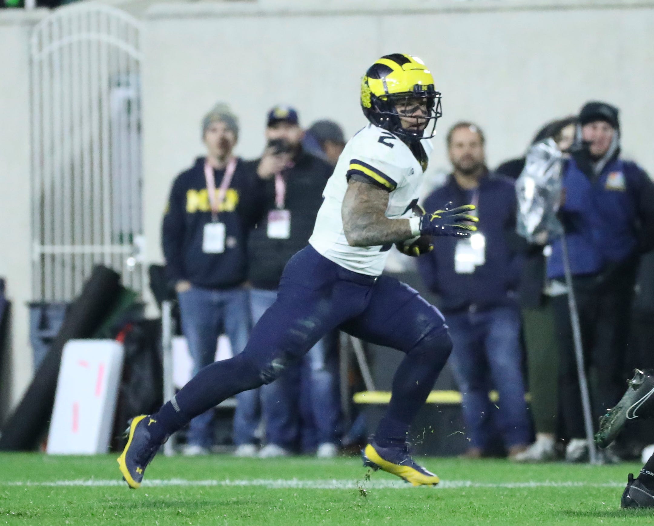 Michigan Wolverines running back Blake Corum (2) runs for a first down against the Michigan State Spartans during second-half action at Spartan Stadium in East Lansing on Saturday, Oct. 21, 2023.