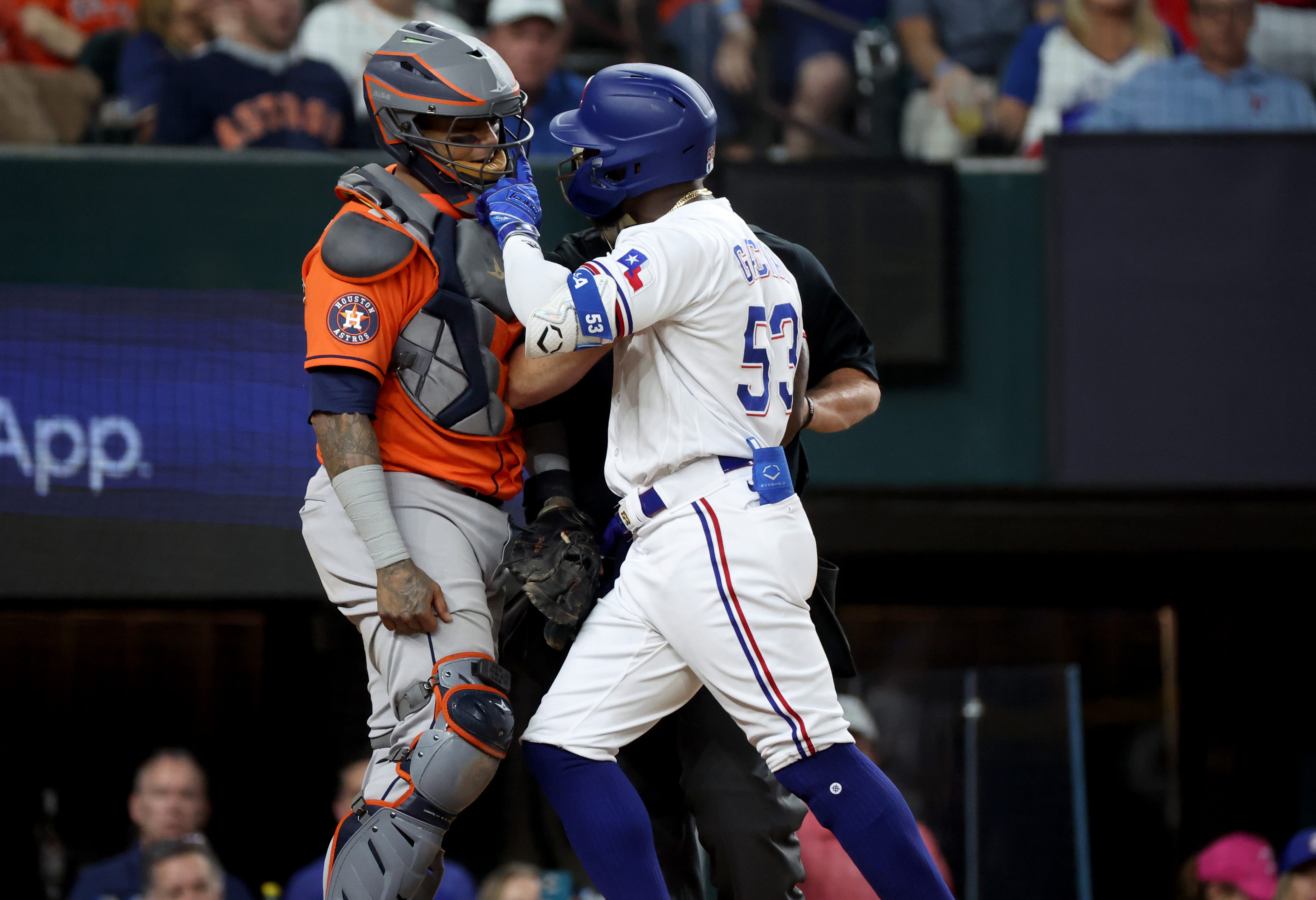Adolis Garcia confronts Astros catcher Martin Maldonado after getting hit by a pitch in the eighth inning of Game 5.