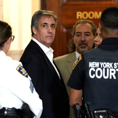 Donald Trump's former attorney Michael Cohen looks on at court during a break in the former presidents's fraud trial in New York on October 25, 2023. Donald Trump's onetime lawyer turned bitter foe Michael Cohen took the witness stand on October 24, 2023 in the business fraud case against the former US president, accusing his ex-boss of "arbitrarily" inflating his net worth.