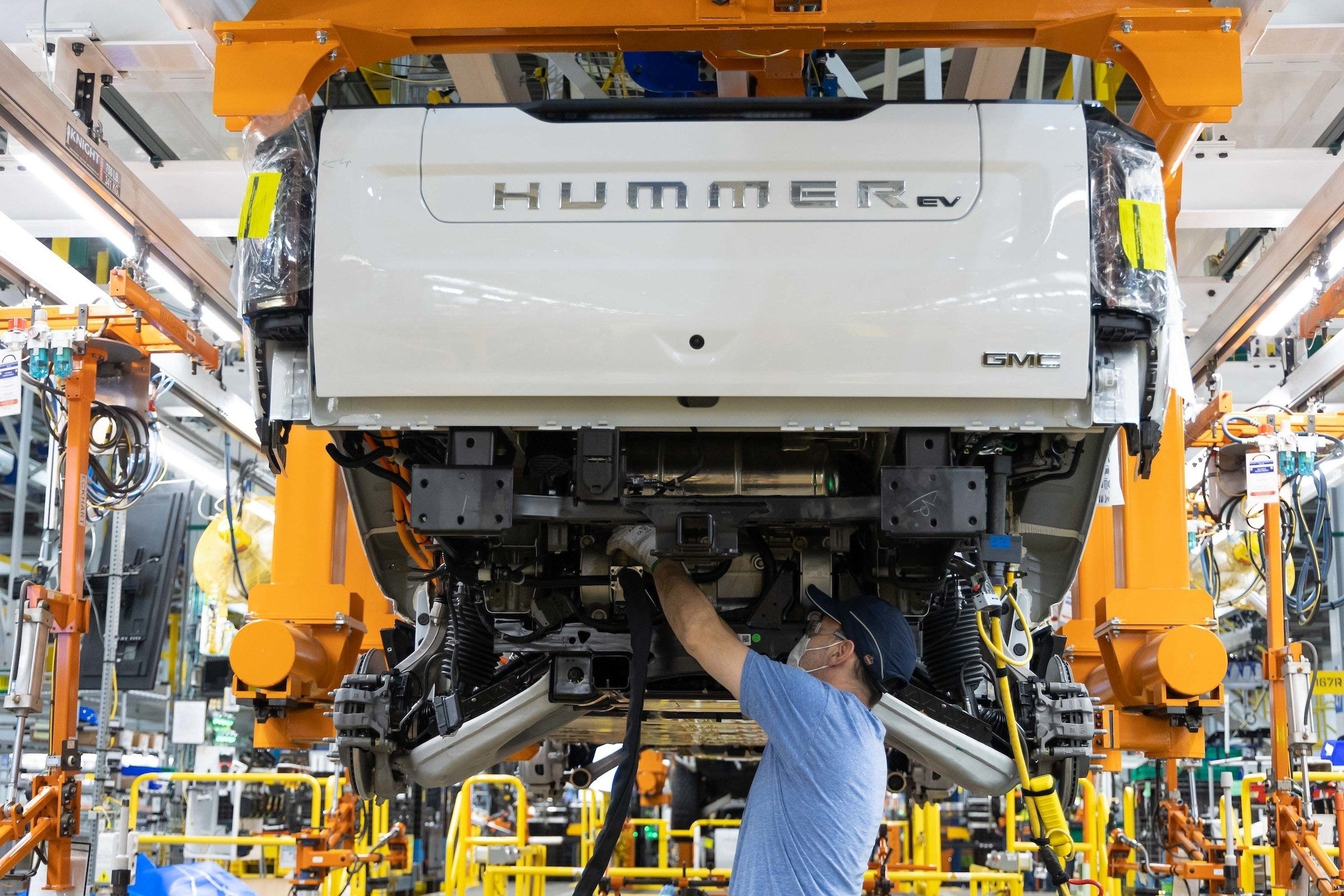 GM will welcome President Joe Biden to Factory ZERO on Wednesday, Nov. 17, 2021, as the company opens the doors to its all-electric assembly plant in Detroit and Hamtramck, Michigan. Here a worker builds a 2022 GMC Hummer EV pickup.