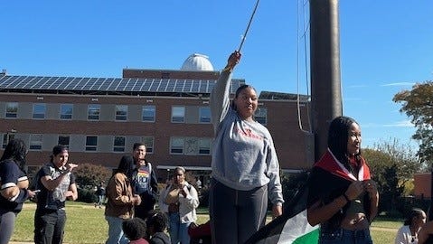 Maya Waller, a student at Howard University in Washington, D.C., waved a Palestinian flag Oct. 25, 2023 at a rally on campus.