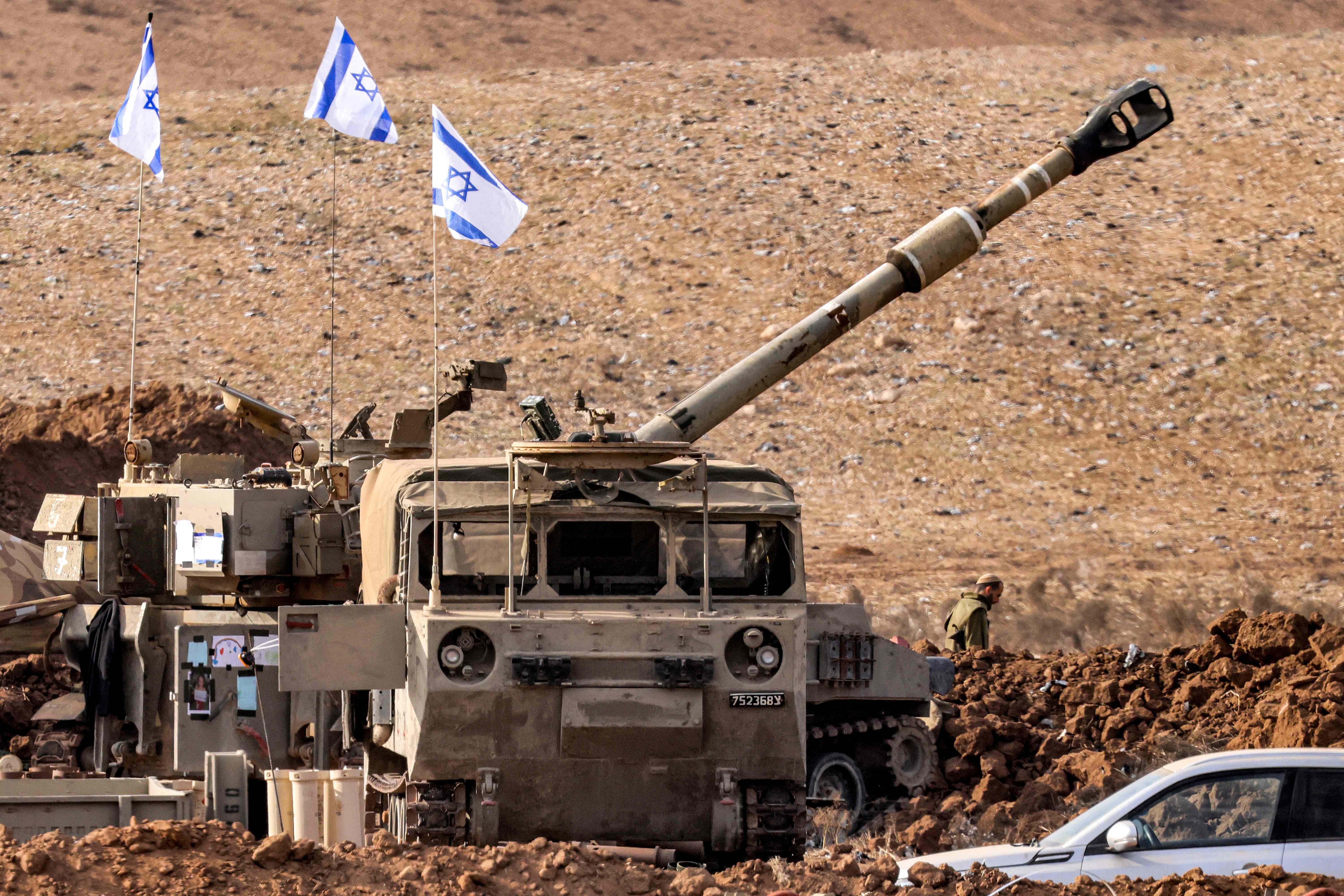 An Israeli army M109 155mm self-propelled howitzer is deployed at a position along the border with the Gaza Strip near Sderot in southern Israel on October 27, 2023 amid ongoing battles between Israel and the Palestinian Hamas movement.