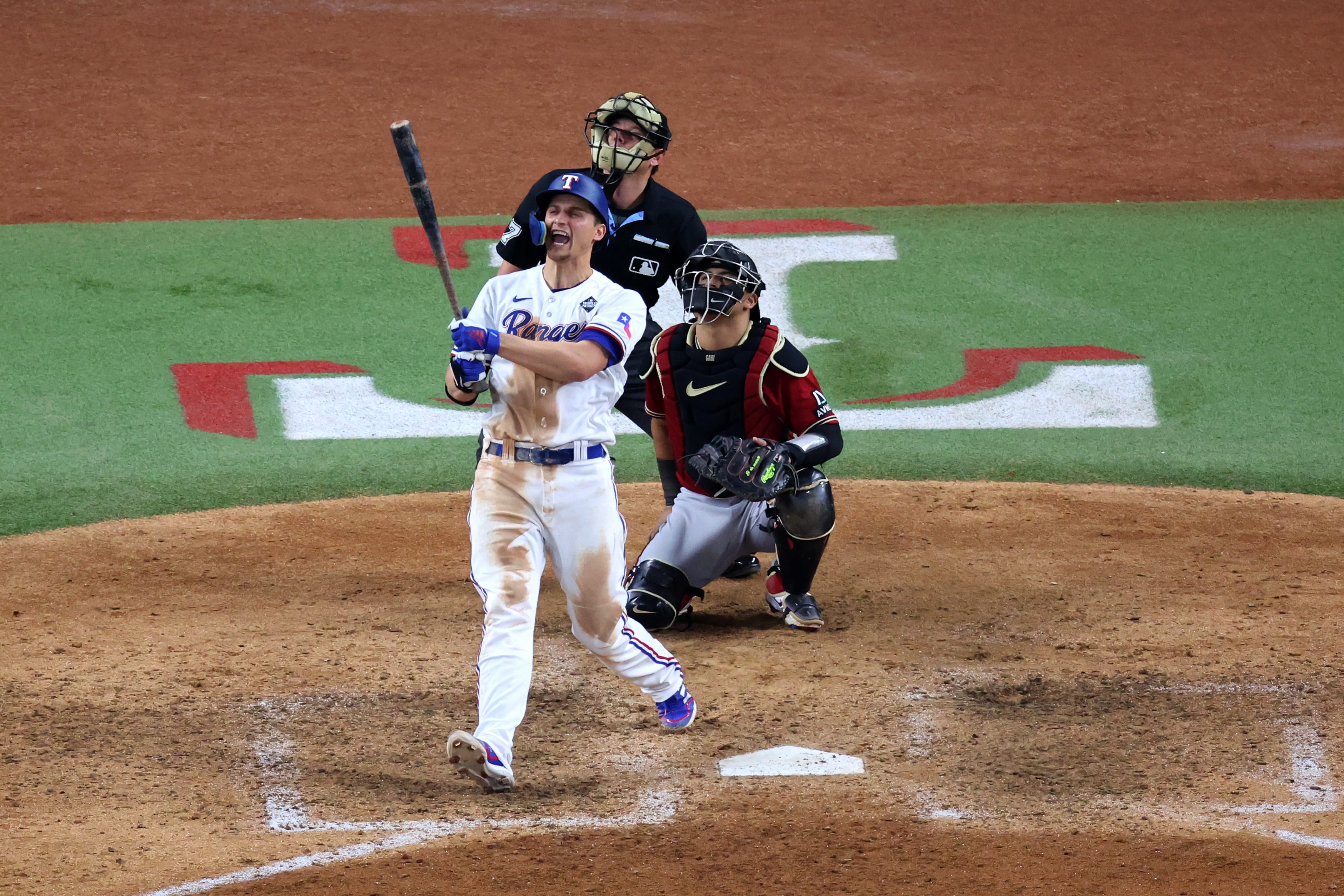 Rangers shortstop Corey Seager hits a two-run homer in the ninth inning against the Diamondbacks.