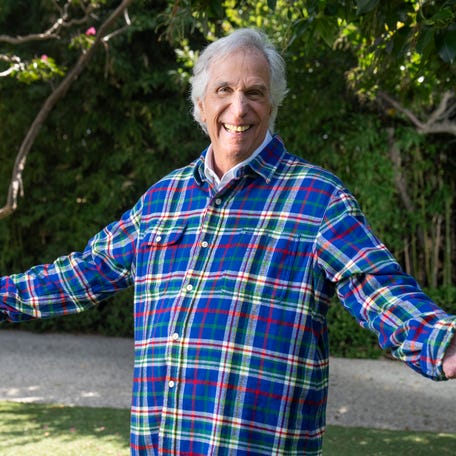 Henry Winkler poses in the front yard of his Los Angeles home. Winkler has a new autobiography: "Being Henry: The Fonz . . . and Beyond."