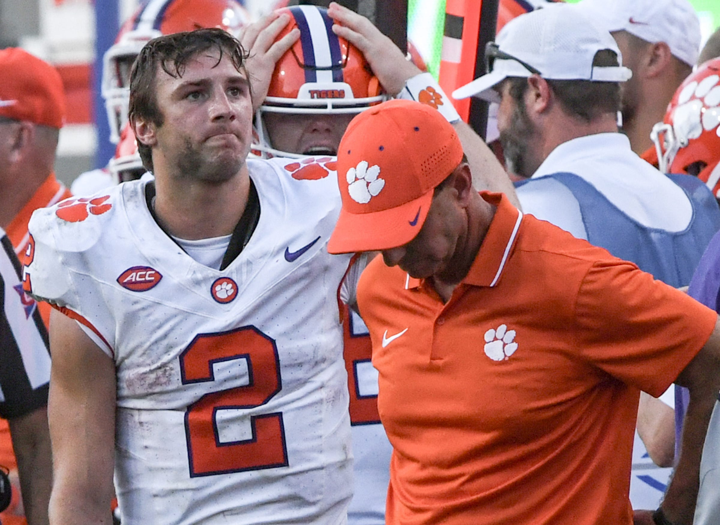 Clemson quarterback Cade Klubnik (2) and coach Dabo Swinney react after the team's loss to North Carolina State at Carter-Finley Stadium.