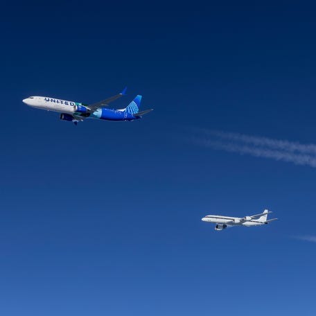 Contrails are visible behind both NASA's DC-8 Airborne Lab and Boeing's 737 MAX 10 ecoDemonstrator during one of the test flights.