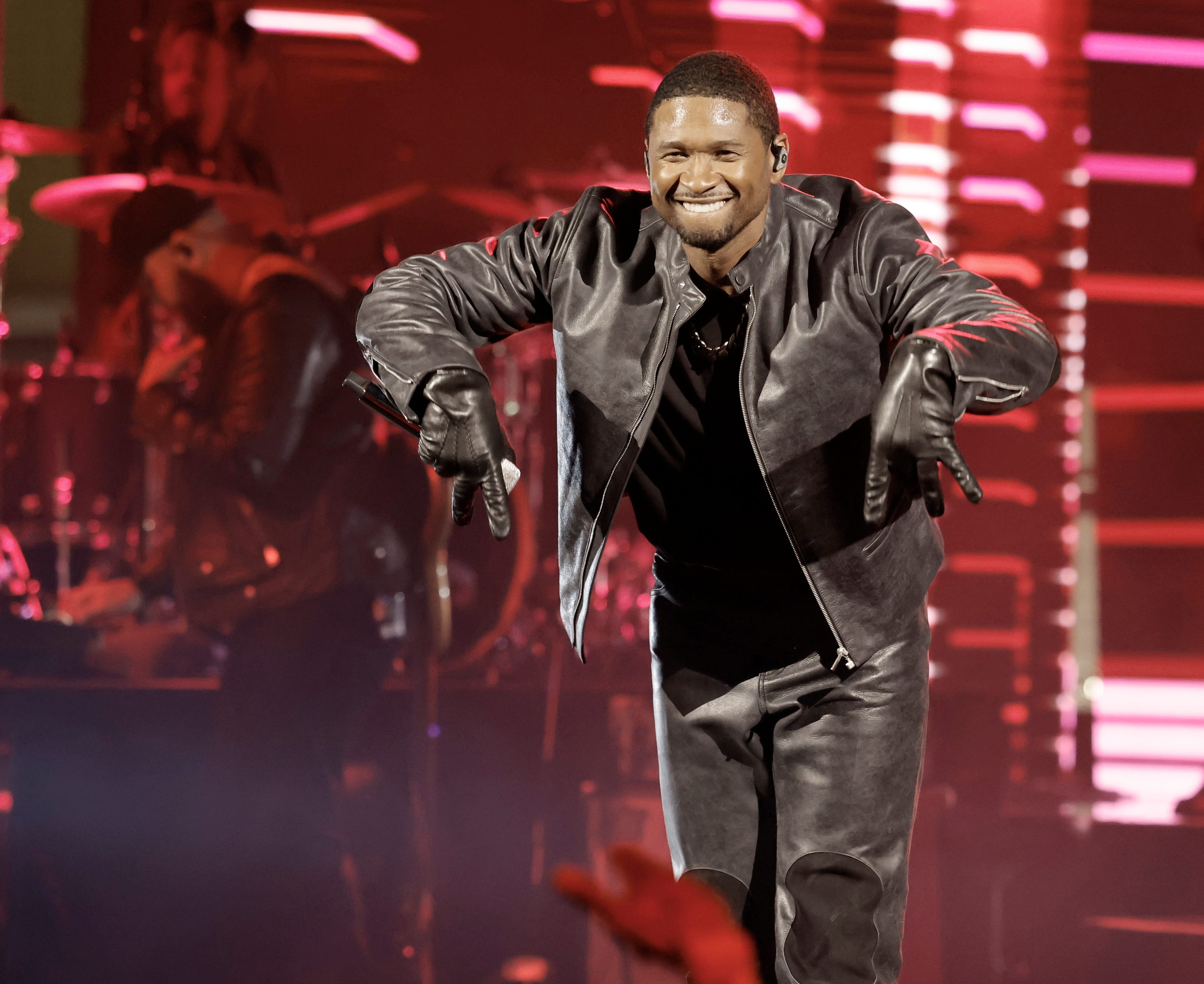 In this image released on Aug. 2, 2023, Usher performs onstage during a taping of iHeartRadio's Living Black 2023 Block Party in Inglewood, California.