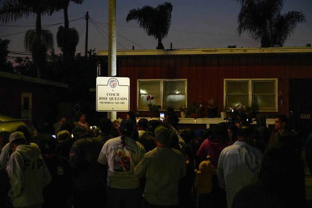 Family and friends of Jose Quezada gather in the square where he was gunned down three months earlier for an unveiling of 