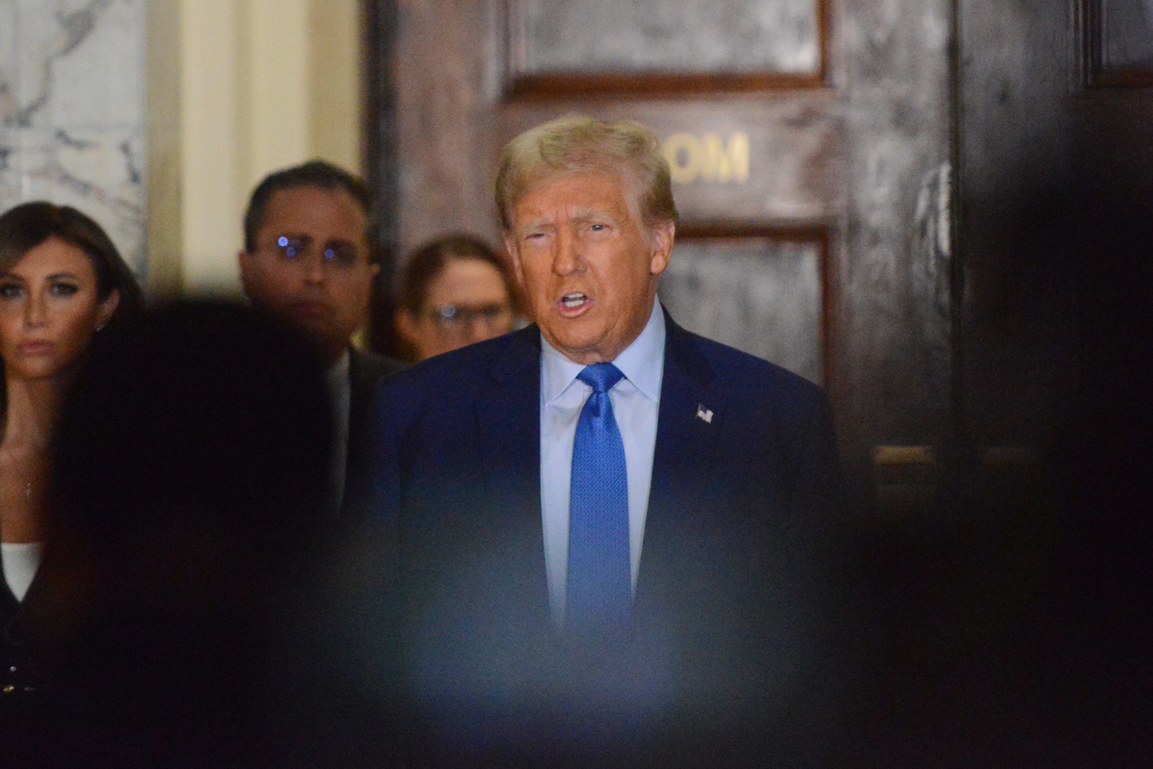 Former President Donald Trump speaks to the media as he arrives for his to testify for his civil business fraud trial at New York Supreme Court on Monday, Nov. 6, 2023 in New York City.