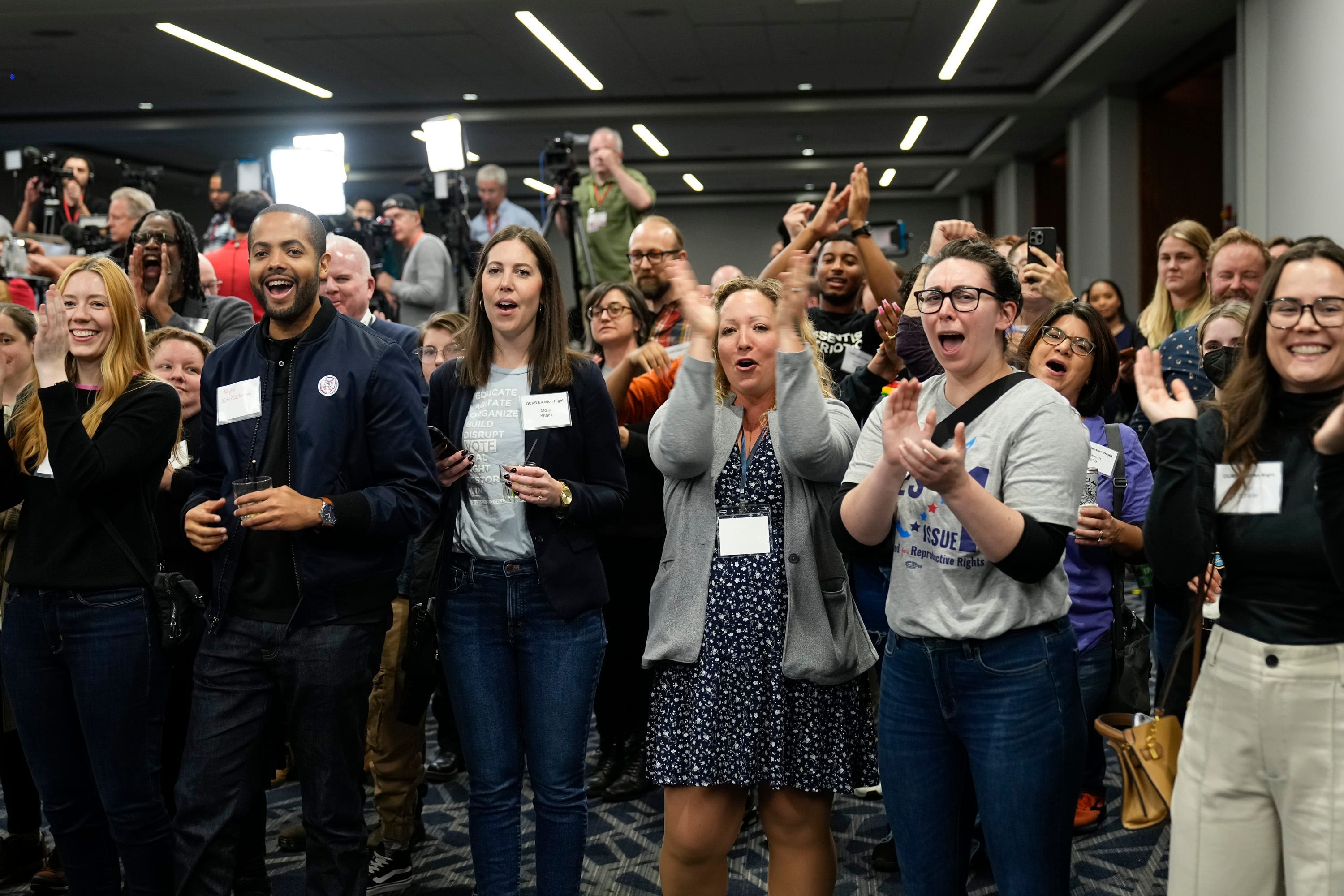Supporters of Issue 1 react during a gathering for the issue at the Hyatt Regency Downtown in Columbus on Nov 7, 2023. The issue establishes a constitutional right to abortion.
