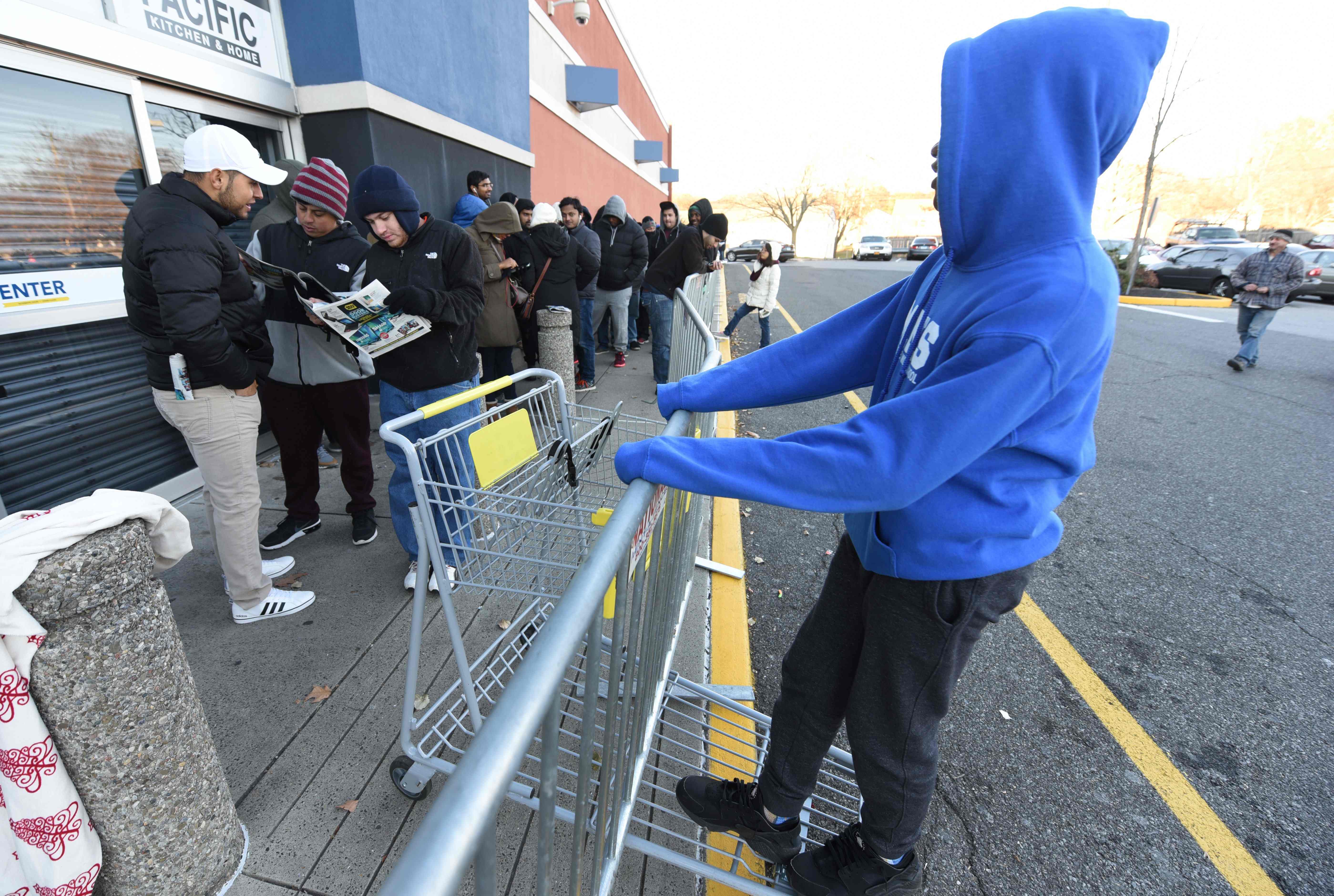 People wait in line outside of Best Buy in Norwalk Connecticut November 23, 2017 for the store to open at 5PM on Thanksgiving Day to take advantage of the Black Friday sales.    As the Christmas shopping season kicks into high gear on Black Friday, the day after Thanksgiving, retailers try their best to attract customers in the face of exploding e-commerce. / AFP PHOTO / TIMOTHY A. CLARYTIMOTHY A. CLARY/AFP/Getty Images ORIG FILE ID: AFP_UJ7JE