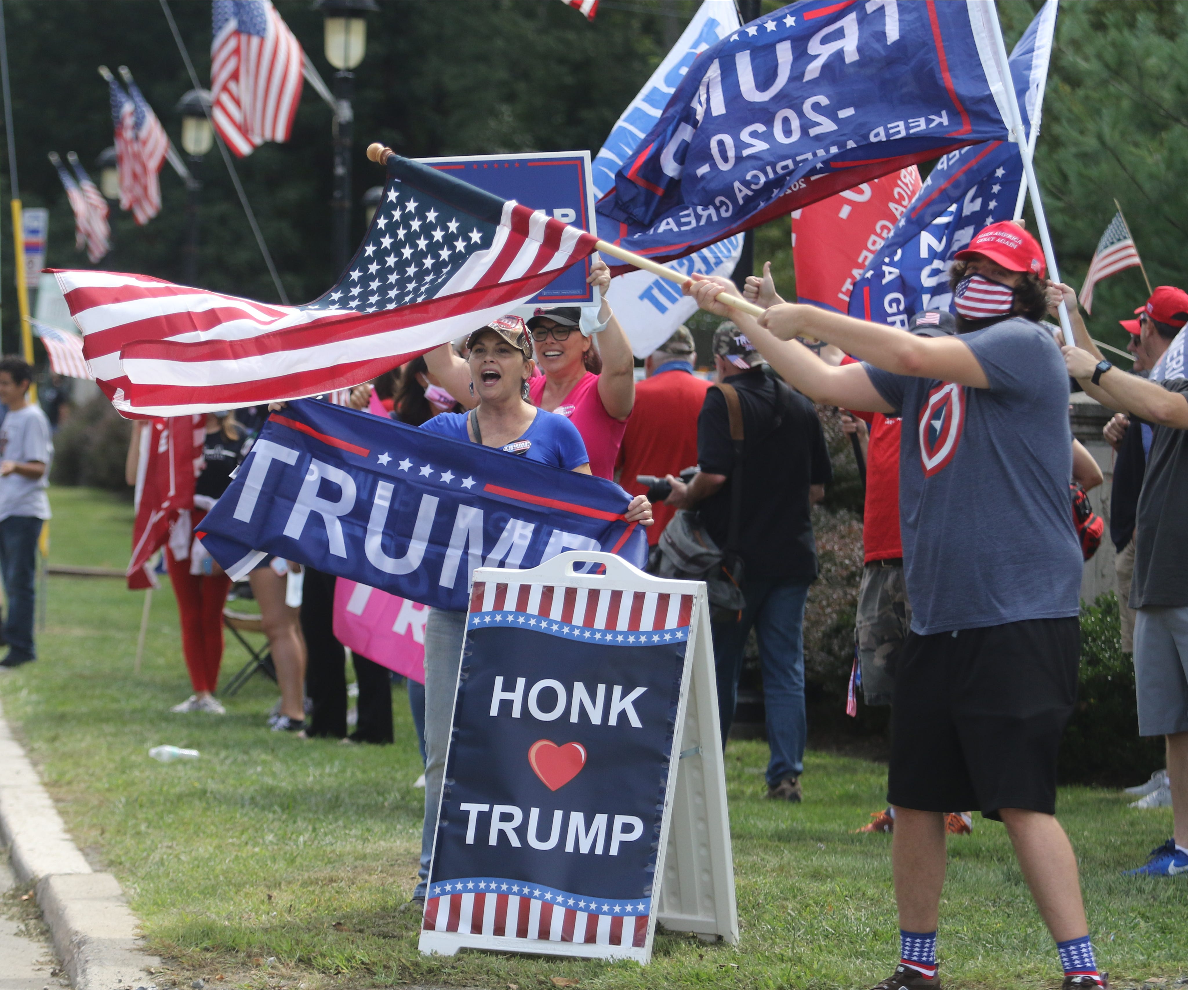 Along Rt 46 by Veterans Memorial Park supporters of President Trump encourage vehicles to honk support in 2020.
