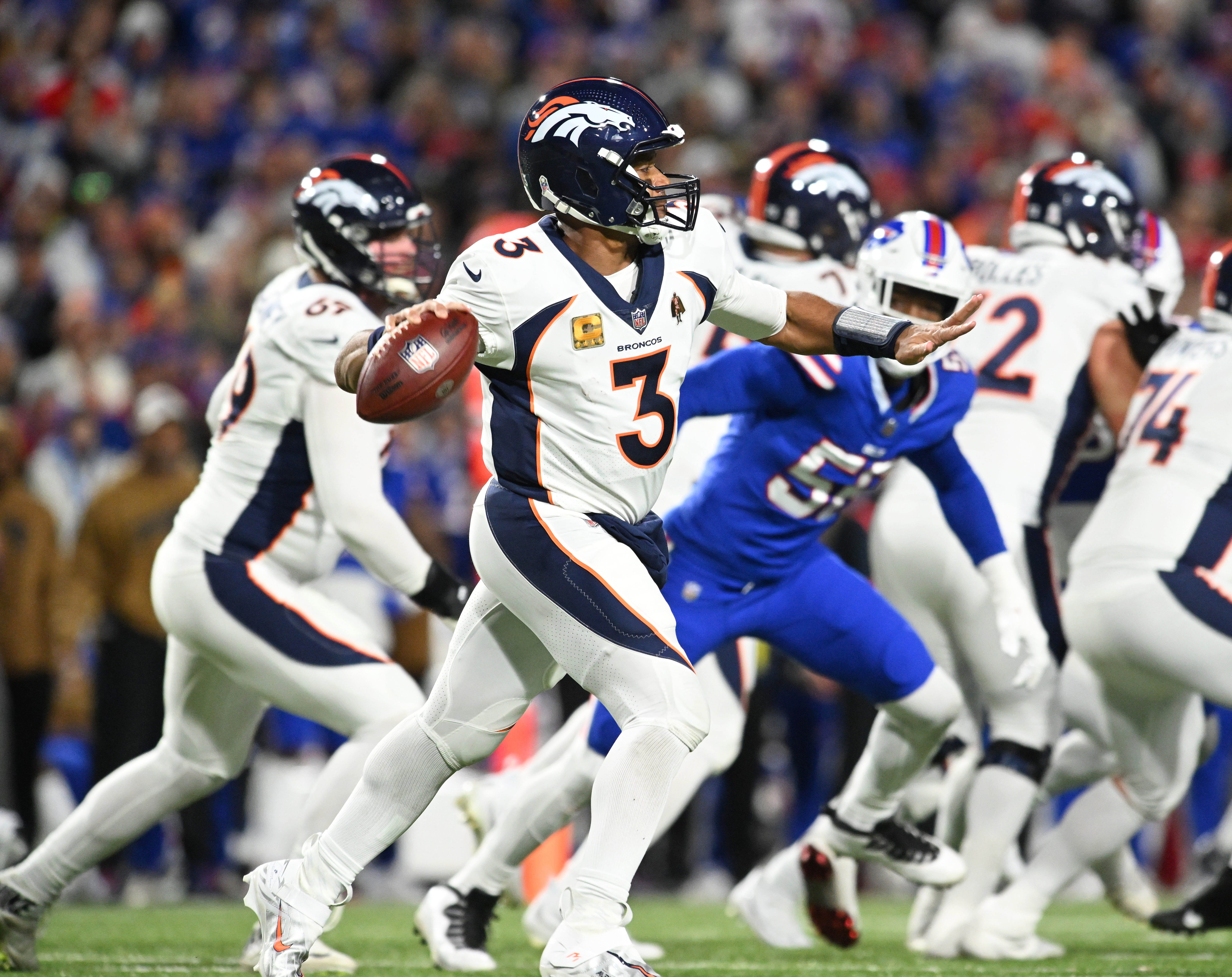 Denver Broncos quarterback Russell Wilson (3) throws a pass against the Buffalo Bills.