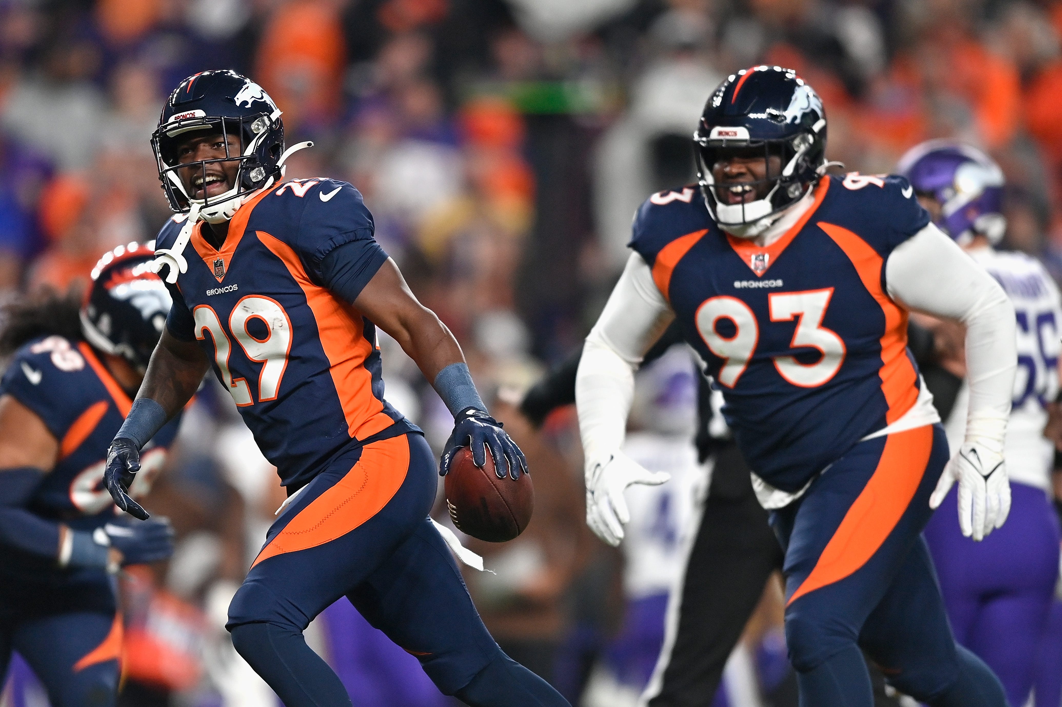 Cornerback Ja'Quan McMillian #29 of the Denver Broncos reacts after a fumble recovery from the Minnesota Vikings during the first quarter of the NFL game at Empower Field At Mile High on November 19, 2023 in Denver, Colorado.