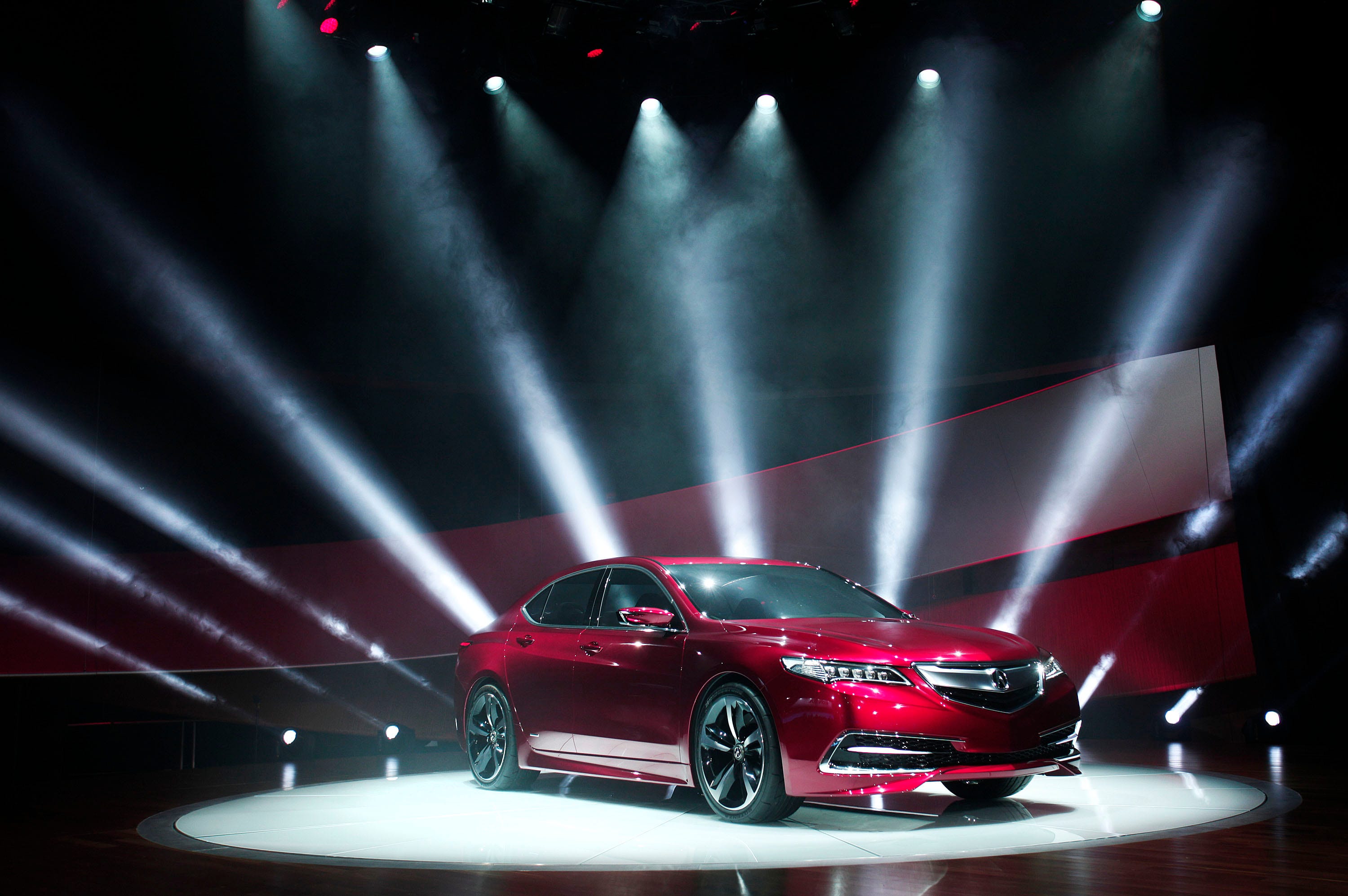 DETROIT, MI - JANUARY 14: The new Acura TLX Prototype vehicle is revealed at the press preview of the 2014 North American International Auto Show January 14, 2014 in Detroit, Michigan. Approximately 5000 journalists from more than 60 countries are expected to attend. The 2014 NAIAS opens to the public on January 18 and ends January 16. (Photo by Bill Pugliano/Getty Images)
