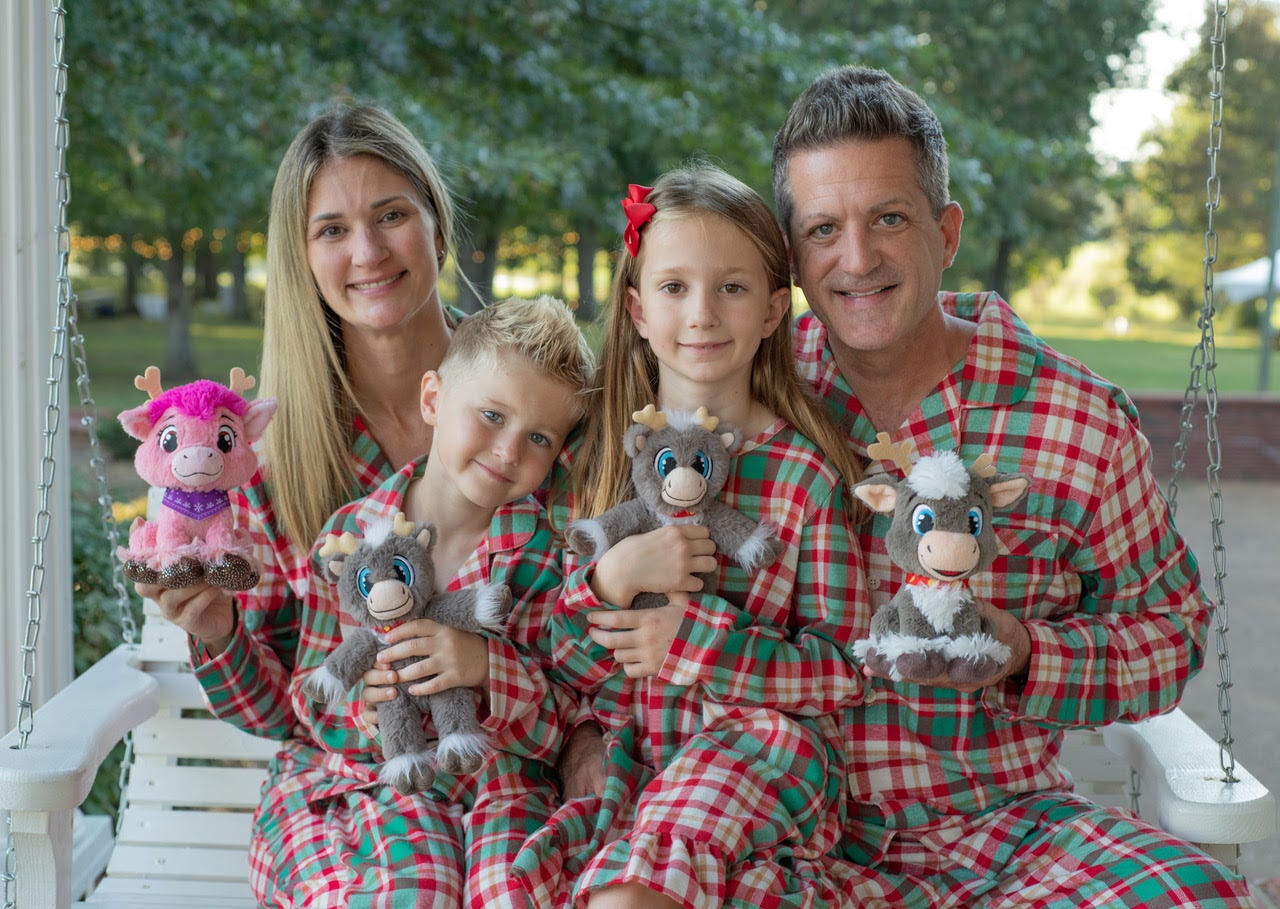Adam Reed with wife Jennifer, son Weston, 6, and daughter Peyton, 8.