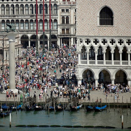 A view of the St. Mark's Square in Venice, Italy, taken on June 8, 2019. Venice authorities have rolled out a pilot program to charge day-trippers 5 euros ($5.45) apiece to enter the fragile lagoon city on peak weekends next year.