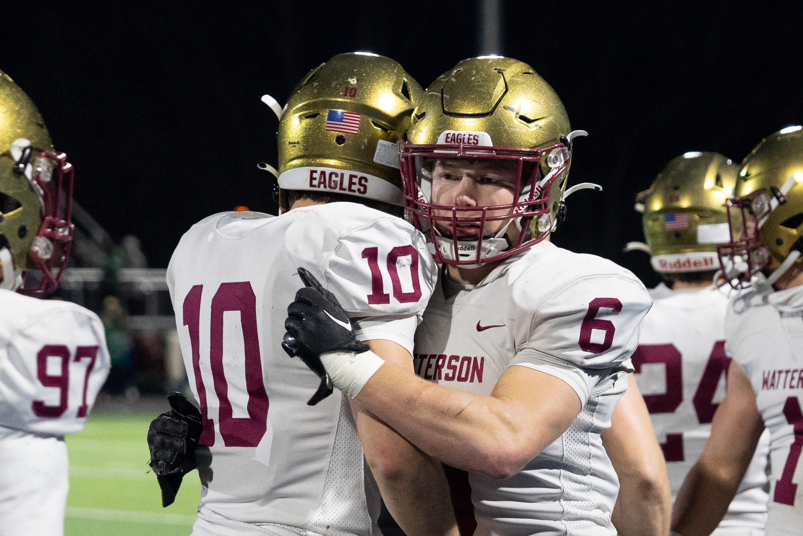 Mark Biagi (10) and Dominic Purcell (6) celebrate during Watterson's Division III state semifinal victory.